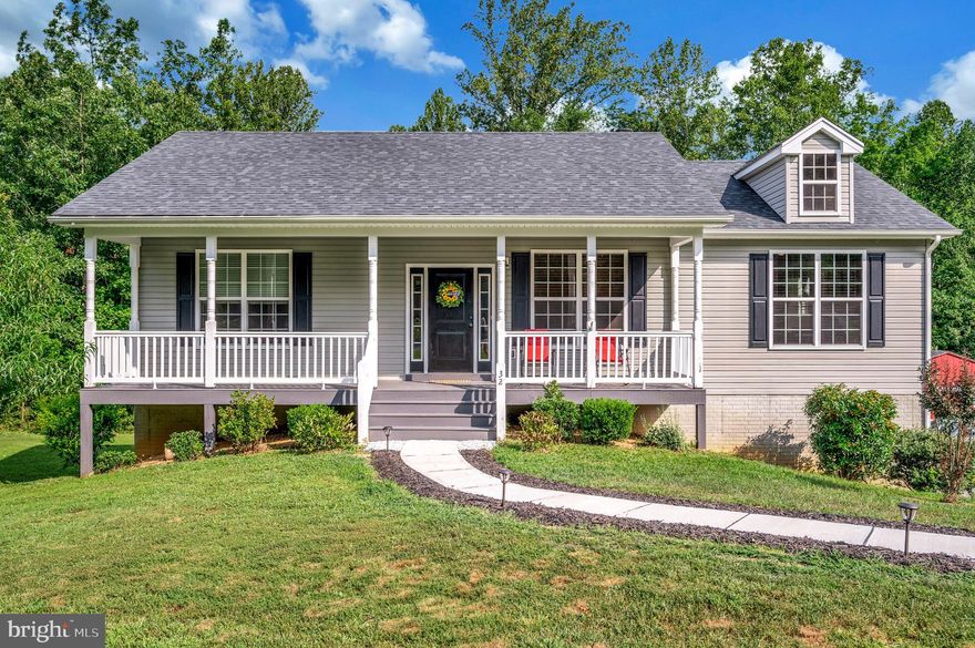 Charming One-Story Home with Finished Basement in Double Spring Estates. 
Welcome to this beautifully maintained 3-bedroom, 3-bath home situated on a spacious 1.56-acre corner lot in the peaceful Twin Spring Estates community, just 2.5 miles north of Louisa. Recently painted and professionally cleaned, this move-in ready home offers a warm welcome from the inviting covered front porch to the spacious rear deck overlooking a private, tree-lined backyard.
Inside, the open-concept layout features a bright living room with a cozy fireplace, a dining area, and a well-appointed kitchen with stainless steel appliances. The primary suite includes a private full bath and walk-in closets, while the finished basement offers a large family room with abundant natural light, a laundry room with utility sink, and a ground-level entrance for added convenience.
A two-car attached garage with automatic doors, a fenced backyard, and a nearly level lot perfect for gardening or outdoor activities add to the appeal. Enjoy the tranquility of a home that backs to trees, with no HOA and convenient access to schools, shopping, and nearby Lake Anna recreation. This property blends small-town charm with modern comfort—ready for you to call it home.