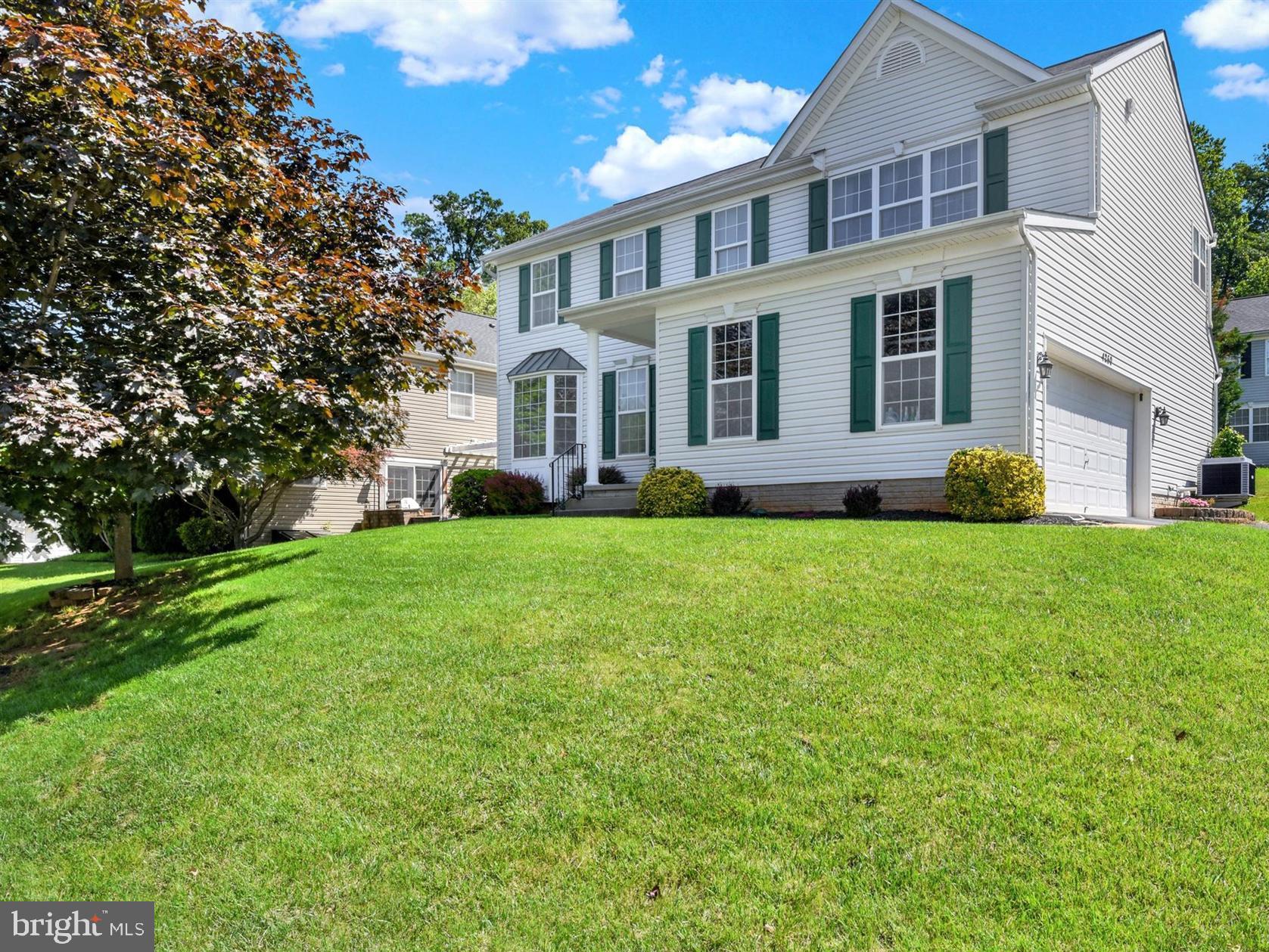 Step inside this warm and beautifully cared-for colonial located in the sought-after North Carroll Farms community of Hampstead. This move-in-ready home offers fresh paint throughout and a thoughtfully designed layout featuring a gourmet kitchen with stainless steel appliances, an island, and a slider leading to the backyard patio — ideal for relaxing or entertaining. The main level features hardwood flooring with carpeted accents, and the family room is centered around a cozy gas fireplace. The roof was replaced in 2017, HVAC in 2016 and the water heater in 2022, offering valuable updates for peace of mind. Upstairs, you’ll find four spacious bedrooms and two full baths. The home also includes a two-car garage and access to fantastic neighborhood amenities like a basketball court, playground, pavilion, and upcoming pickleball courts. Just minutes from downtown Hampstead and major commuter routes, this is a wonderful opportunity that won’t last long.
