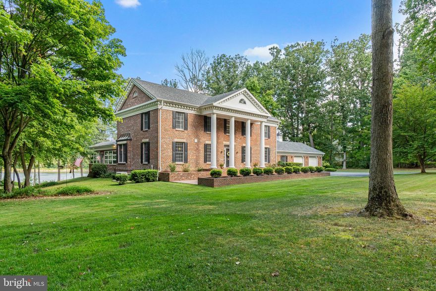 Absolutely Stunning Stately Waterfront Brick home, located in Chesapeake City, Maryland. Nine-foot ceilings, featuring  5 bedrooms and 3.5 bathrooms, to include two masters with one being located on the 1st floor. Just exquisite from top to bottom. So many wonderful features, with a new dock, featuring two boat lifts, one holding 10,000 pounds and the other holding 12,500 pounds, along with a  private boat ramp, along with a private beach, and waterfront to the Canal, where you can sit on your dock or beach and watch the fireworks.  The dock is truly a dream, featuring several power outlets( 120v)and an additional that is (220-240v) at the end of the dock to allow larger vessels and separate on-dock circuit breakers.  The water at the dock is drinking water and goes through the water treatment system from the house. It is so convenient that the power and water can be turned on & off from inside the house, and from the dock.   As you walk up the beautiful paver walkway and approach the gorgeous front porch, you will enter the home and be amazed at how immaculate this home is. Featuring a beautiful gourmet kitchen with granite counters, a double wall oven with a separate gas cooktop, and an island you will fall in love with. The two-story great room is just stunning, featuring sliding doors and windows to the ceiling to allow an amazing view.  You can enjoy your breakfast in the gorgeous three-sided sunroom, overlooking the beautiful yard.  You will find yourself entertaining a lot & grilling from the beautiful multi-level brick patio. Imagine the yard games and events you could have here. All of the bedrooms are generous in size with great closet space. The 2nd floor features a wing with 3 bedrooms a full bath and laundry facilities.  The basement features a bar & a wood-burning fireplace.  The hardest decision you will make is where you will sit to see the gorgeous views. There is so much more to this stunning home!  Have your groceries delivered, make memories, and never leave!
    ( We can certainly understand why you would be very eager to see and or drive by this amazing home, however, it is located  on a private road, so please do not drive by unless you have a confirmed appointment, Thank you so much for understanding.)