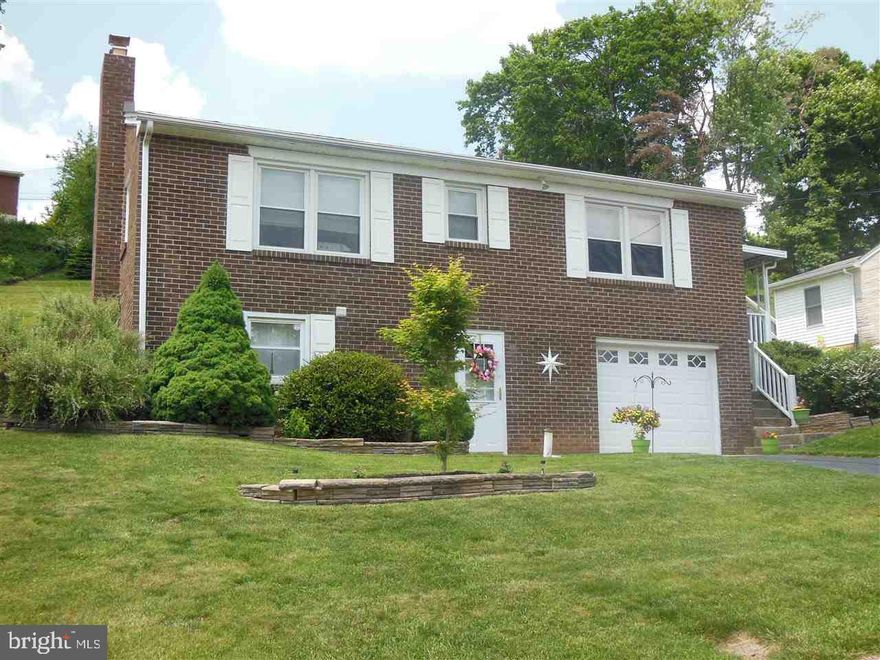 Beautifully maintained raised rancher with many special features.  Second driveway brings you to the first floor level.  Hardwood floors, bright, updated kitchen and bath and two very nice bedrooms.  Newer roof, central air, hot water heater and furnace.  Lower level has walk-out family room with brick fireplace.  There is a large utility room with washer and dryer.  Very quiet street.  If you've been looking for that perfect home, here it is!