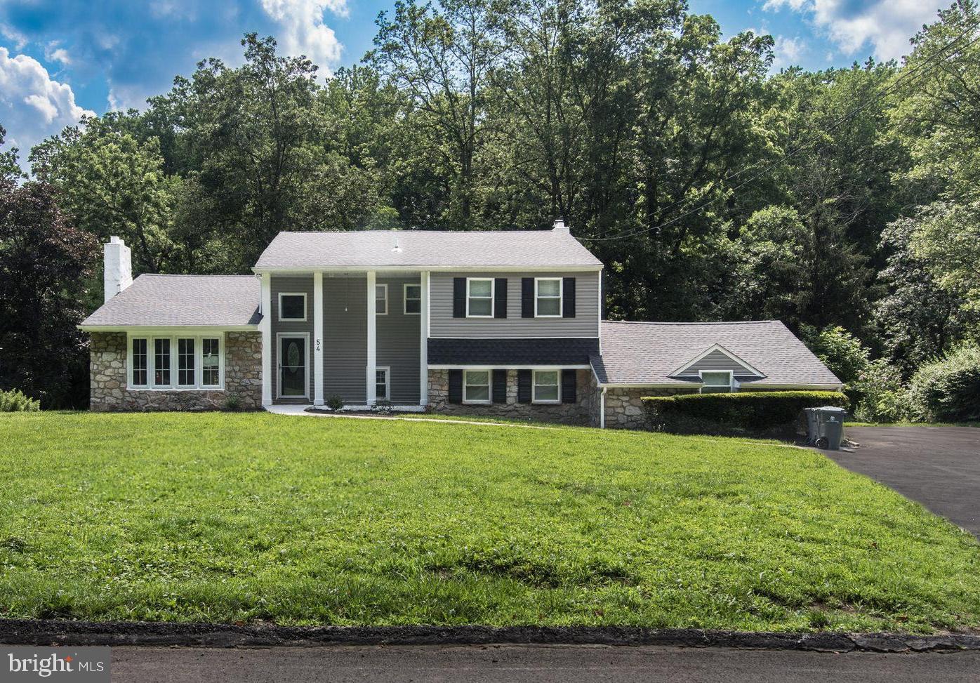 LOOK NO FURTHER! Here is your chance to live in the desirable Londonderry Woods neighborhood near Lorimer Park in Huntingdon Valley! This newly updated 5 bedrooms 3-bathroom home features an IN-LAW SUITE with its own private entry and access to the main house. This home is situated on a peaceful road and backs up to Pennypack Creek. As you step through the front doors, you’re greeted by a warm and inviting foyer with high ceilings and newly stained wooden floors. Immediately to the left is a bright and cozy living room with glass windows giving you a lot of natural light. The living room boasts gleaming hardwood floors, the kitchen and dining area seamlessly flow into one another, making it perfect for hosting family and friends. In the newly updated kitchen, you will find beautiful white shaker cabinets with plenty of cabinet space, spacious island, beautiful granite counter tops, and new stainless-steel appliances. This kitchen is perfect for preparing family dinners or entertaining family and friends. Off the kitchen you will find the dining room that has newly finished hardwood floors and French doors that lead to a deck that oversees the back yard and brings great views of the creek and the sounds of nature. Back inside, off the dining room you will find a great-sized family room with a wood fireplace that is the perfect place to relax and unwind after a long day. Upstairs, you will find 4 large bedrooms, including a primary suite with full bathroom and an additional hallway bath. Back downstairs, off of the kitchen is where you will find the door that leads to the lower level that you can use as an in law suite. The lower level consists of a large den with a fireplace, kitchen area, a full bathroom, and an oversized bedroom. In the bedroom there are French doors that lead to the back yard providing you with a private entry. The den has large sliding glass doors that provide plenty of natural light and lead to a large concrete patio that is perfect for hosting family and friends. The backyard is great for entertaining and backs up to the creek where you can fish or just pull up a chair to listen to the sounds of the creek & nature. The view in the backyard will not disappoint. This home is in the highly desirable Abington School district. The park is within walking distance and is a short drive to local grocery stores. Don't miss this amazingly spacious home on almost an acre sized lot!