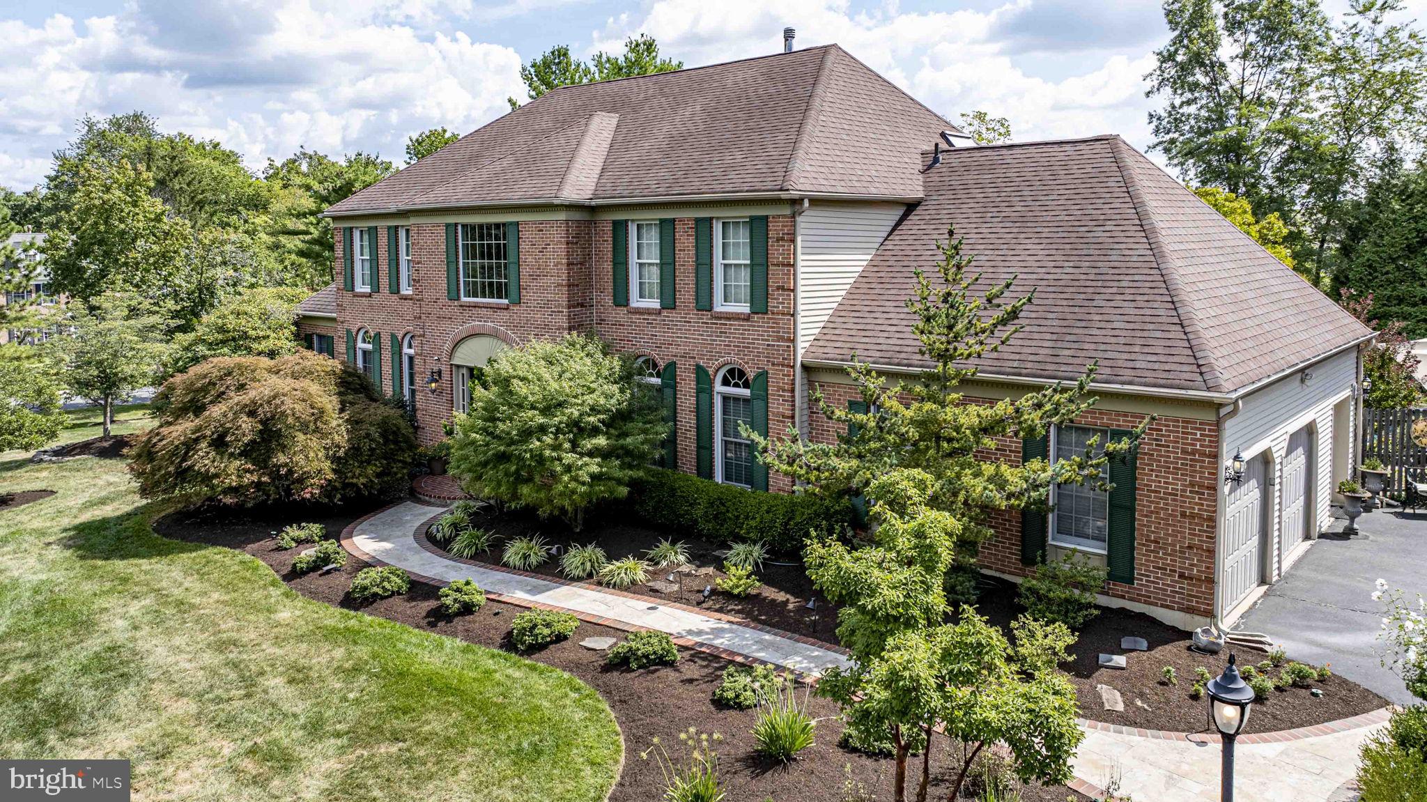 Showings to start Friday, Sept. 12. This is a rare opportunity to own a meticulously cared-for home. Located in the highly sought-after Gwynedd Knoll neighborhood of Lower Gwynedd Township, this exceptional home is a perfect blend of classic elegance and modern convenience. Situated on a nearly one-acre corner lot within the highly regarded Wissahickon School District, it offers a private and amenity-rich lifestyle. The beautifully landscaped grounds create a true outdoor sanctuary. In 2003, a tranquil retreat was established with the installation of bluestone, flagstone, and paver patios, along with a serene two-stage waterfall koi pond. The ultimate backyard centerpiece, an in-ground saltwater pool, was added in 2013, providing a resort-like atmosphere just steps from the house. Adjacent to the pool, a large shed with windows and electricity offers the perfect space for a cabana or outdoor bar. This area is ideal for entertaining, especially with the addition of a backyard firepit and seating area in 2014, perfect for cozy gatherings. Inside, the home has undergone extensive and thoughtful renovations, making it both beautiful and highly functional. The heart of the home is a chef's luxury kitchen, completely remodeled with two islands and sliding doors that open to the patio, creating a seamless indoor-outdoor flow. The kitchen is a culinary dream, equipped in with top-of-the-line appliances including two separate Kenmore Elite dishwashers and a suite of Jenn-Air appliances –41" wide counterdepth refrigerator, a 35” 6-burner gas stove, in-drawer microwave, and double ovens–one of which is convection. Floor-to-ceiling cabinetry provides ample storage and display space. The kitchen also has space for a large kitchen table with views of the outdoor area through double doors. A unique and practical feature is the expanded mudroom, which includes a garden sink, extra storage with full size refrigerator within the cabinetry, and a full bathroom with access to the patio. The interior's sophisticated design begins in the two-story foyer with its elegant butterfly staircase. Hardwood floors flow through the foyer, dining room, living room, and a separate bar area off the family room. The first floor also features a sunroom, perfect for a game room, and a private office with plantation shutters. The spacious family room is a welcoming space with a brick wood-burning fireplace and opens directly into the renovated kitchen . This room also has access to one of the outdoor patios through sliding glass doors.
Upstairs, the primary suite is a true retreat with a vaulted ceiling, arched windows, and three separate walk-in closets. The spa-like primary bathroom was remodeled in 2023 to include a free standing soaking tub, walk-in shower, double-sink vanity, and radiant heat flooring. Three other generously sized bedrooms, one with an attached bonus or craft room, and a beautifully updated hall bathroom complete the second floor. This second bath also has radiant heat flooring. The remodeled finished basement is an entertainer's paradise, with wall-to-wall wool carpeting and a dedicated home theater. The unfinished part of the basement houses two oversized washers and dryers and an abundance of storage areas. Practical upgrades throughout the home include a new roof, new front doors, and replaced windows in the living room, dining room, foyer, and many bedrooms in 2010. The kitchen and family room sliding doors replaced french doors. For year-round comfort, the home has two newer HVAC systems, installed in 2015 and 2016.
