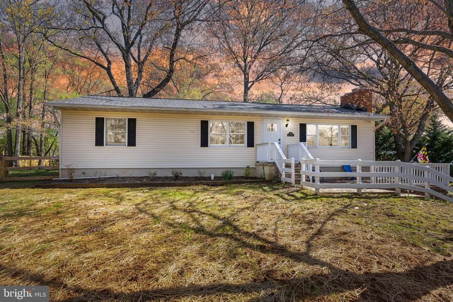 Beautifully renovated. Bright natural light. Just under a half an acre of fenced-in yard.
From the moment you arrive, this home gives you space to breathe, and room to live.

Step inside and you’re immediately welcomed by an expansive kitchen that steals the show. The kitchen is designed with a long island perfect for gatherings, conversations, and everyday life. The open flow connects seamlessly to the dining room and living room, creating the kind of space where everyone can be together, yet still enjoy their own corner of the home. A cozy fireplace anchors the living area, adding warmth and charm to every moment.

Just off the kitchen, a screened-in porch invites you to step outside and relax, with views of your wide open, fenced-in backyard. Whether you’re looking for backyard space for hosting, playing, or simply unwinding after a long day, this is the one.

The main level offers three bedrooms and two full baths, all updated and move-in ready. Head downstairs to your finished basement with a second fireplace, a large entertainment space, a bonus room for an office or guests, a full bathroom, and a private entrance.

When you’re ready to get outside, your community beaches, marina, and basketball courts are a short drive away.  Close to downtown Annapolis for shopping, dining, and waterfront fun.

Here, you have it all:
Move in ready. Community. Space to grow. A home that’s ready for you to live life fully, inside and out.