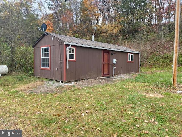 Camp/cabin situated on 3.97 acres in Tuscarora Twp, Honey Grove! 1 bedroom, 1 full bath, living room w/ wood stove & kitchen! Over 400 ft of road frontage. Well & septic. Large 3 bay shed, 2 smaller sheds & rustic 1 car garage.