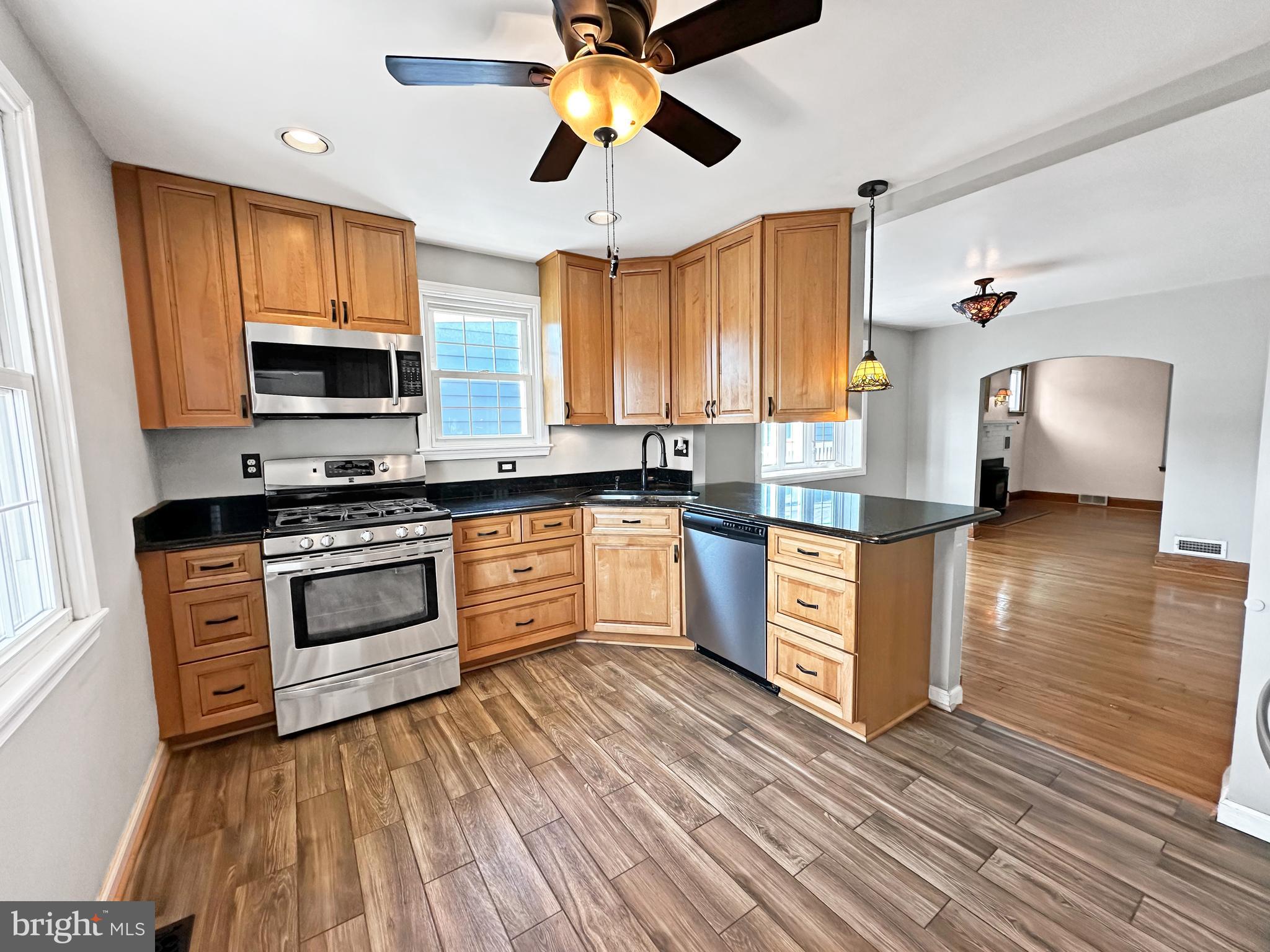 Amazing price for this Super Spacious (almost 3,500 sq ft) 5 bedroom, 3 full bath solidly built home in Roland Terrace. Many fantastic updates including a gorgeous chef’s kitchen featuring 42’ “soft close” maple cabinets, granite countertops, (5) burner gas stove and stainless appliances. The main level also features three bedrooms, a renovated full “tiled” bath, a living room with a fireplace that has a pellet stove insert (great to help with heating bills), a dining room and a family/sunroom off the kitchen that is freshly painted and has new carpeting. Most of the main level boasts easy maintenance solid oak hardwood flooring. Upstairs there are two additional nice-sized bedrooms and a full bath. The newly “part” finished lower-level rec room is huge and features 8’ ceilings and an updated “tiled” full bath as well. Heading outside, you will enjoy a paver patio – ideal for grilling and entertaining, a level fenced lot, off street parking and a car lover’s dream – an oversized 2-car side load garage with auto opener and electric. Some other great features of this beautiful home – updated windows; plantation shutters; cozy enclosed porch with patio swing; new carpet; updated Trane gas furnace and gas H2O heater; 2-zone HVAC; all appliances convey & more! This home embodies the timeless charm of yesteryear while blending seamlessly the modern niceties of today. Won’t last! Make an appointment to view today!