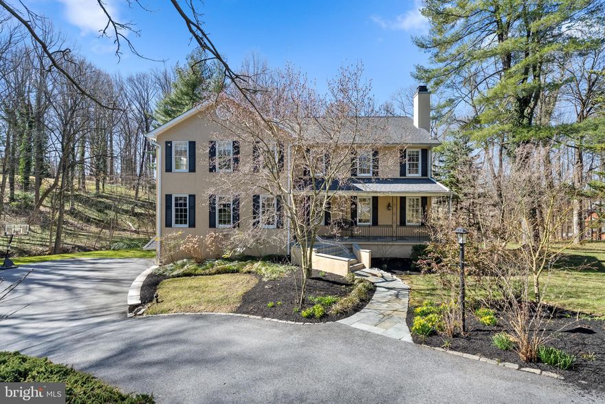 Welcome to 930 Academy Lane, a lovely home nestled on a private cul de sac street in the heart of Bryn Mawr. This exquisite property boasts ample indoor and outdoor living spaces that are sure to impress. A lovely front porch graciously welcomes you to the front door. As you enter, the main floor greets you with a warm and inviting atmosphere. The hardwood floors and natural light throughout the house create an ambiance of comfort and elegance. You will be able to appreciate the beauty of the house from the moment you walk in. The first floor features an office that creates privacy while you work from home, and a spacious living room with a wood burning fireplace. Nearby is the formal dining room, which is wonderful for entertaining guests. The fully equipped kitchen features stainless steel appliances, crisp white cabinetry and flows into the spacious and bright family room. The open floor plan makes for an easy flow from room to room. The dining room, kitchen, and family room each open to the impressive decks that overlook the wooded grounds and provide a peaceful atmosphere to relax in nature and listen to the creek run below you. This home makes for unparalleled indoor/outdoor living, ideal for entertaining guests or relaxing with family. The laundry room and powder room complete the main floor. Four bedrooms and two full bathrooms are situated on the second floor, providing privacy and tranquility. The master bedroom is spacious, with an ensuite bathroom, a walk-in closet, and its own private balcony. The additional bedrooms have ample closet space and plenty of natural light, creating a cozy and relaxing atmosphere. Downstairs is the finished walk-out basement that offers tons of additional living space, perfect for a game room or movie theater. There is also an additional bedroom and full bathroom. The lower level is large and offers endless possibilities to make it your own. The location cannot be overlooked, with some of the best restaurants, shops, and entertainment nearby; as well as award winning schools and an easy commute to Center City. With its abundance of indoor and outdoor living spaces, well-maintained finishes and prime location, 930 Academy Lane will be a true pleasure for its new owners.