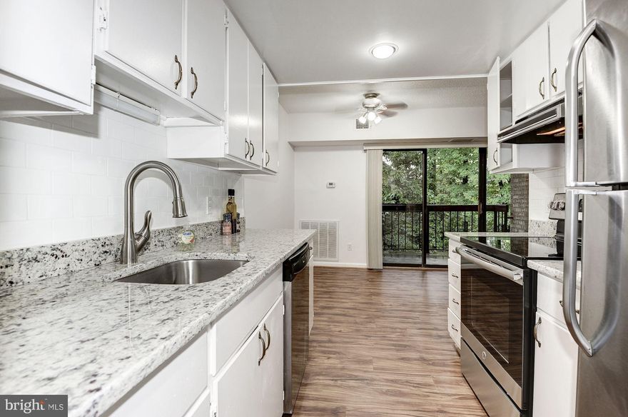 Updated Condo NEW wood floors, carpet, granite counter top, kitchen sink/faucet and fresh paint . Unit located on the 2nd floor, features 3 bedrooms, 2 full baths, open living room, dining room, a private balcony with a view of the woods and reserved parking. Close to Reston Town Center, Dulles Airport  and Toll Road 267.