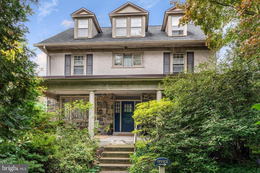 Welcome to 210 Kent Road, a premier 6-bedroom, 3+ bath stone classic in highly sought-after Ardmore. Thoughtfully updated while preserving its early c.1900’s soul, this home features detailed millwork, wood floors, solid doors, authentic hardware and deep-silled windows throughout. An idyllic open-air porch serves as an extra parlor for relaxation. 

The welcoming foyer leads to a fireside living room and a formal dining room designed for gatherings. The heart of the home is the sun-filled chef's eat-in kitchen, featuring ample cabinets space, quality appliances, a large island, spacious sun-filled breakfast area that seamless flow to the deck. A powder room, pantry and back staircase complement the main level.

A standout feature is the private professional office with its own entrance and powder room—perfect for a home business or a main-floor in-law suite. 

Ascend via the main or the charming back staircase to the private quarters. The Primary Suite is a bright, sunny sanctuary with ample closets on the second floor featuring a spa-like luxury bath with a soaking tub, separate stall shower, and double vanity. The second level has three additional bedrooms, with unique attached storage spaces as well as a hall bathroom. The third floor features two additional bedrooms, one of which is quite large, offering ample space, natural light and architectural interest. A cedar closet is found in the third floor hallway.  These rooms provide endless possibilities for teens, guests, nursery, library, or hobby space. The hall bath is a combination bath and laundry space. This level is extremely bright. 

The property boasts a private driveway with two car detached garage. The level, private yard backs directly onto the peaceful, community Packer Park and Garden. Enjoy unmatched walkability to Suburban Square’s shops, Arnold Field, and the Ardmore train station for an easy commute to Philadelphia, NYC, and DC by regional rail and Amtrak service.