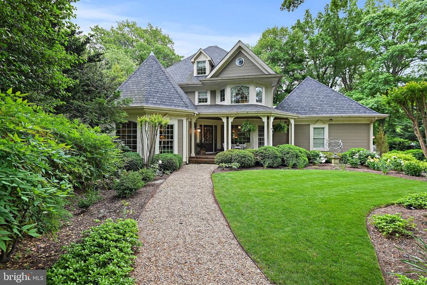 CONTRACTS DUE ON THURSDAY, MAY 23 BY 6PM** Enchanting custom craftsman style home nestled on a .50 AC lot on one of Vienna's most beautiful streets. Superb location minutes to Vienna shopping centers, Tysons Corner, W&OD Trail, and fresh market. Charming quiet neighborhood.  Enjoy the gas light flickering in the front yard while sitting on the front porch. The meticulous front garden gives you privacy and leads to the gorgeous porch. Inside, there are 4 levels of luxury with huge windows, unique nooks and crannies, angled turrets, and exquisite details throughout. The foyer opens to the curved staircase, octagon living room with gas fireplace and the formal dining room. There is a MAIN LEVEL primary suite with walk-in closet and grand bath with soaking tub and shower. The gourmet kitchen is gorgeous with SubZero refrigerator, custom pull out spice rack, large island and morning area opening to the bright great room with Cathedral ceilings, skylights, wood fireplace, bar area with plumbing for sink and arched window wall. The sliding doors from the kitchen opens to the huge deck is perfect for outdoor dining, entertainment, and relaxation which includes a spa deck with hot tub overlooking the garden, tall trees, flagstone walkways and patio with fountain and outdoor lighting. The upper level features a 2nd primary suite with walk-in closet and 2024 renovated grand bath with Jacuzzi and steam shower, 2 bedrooms, one with balcony and a spiral staircase leading you to the loft level, perfect for an artist, play room, den, etc. The lower level has 2 outdoor entrances, a rec room, exercise area, den, office, media lounge with barrel-vault ceiling wine cellar, large workshop room, and lots of storage. Built-in speakers in living room, dining room, family room and outdoors.