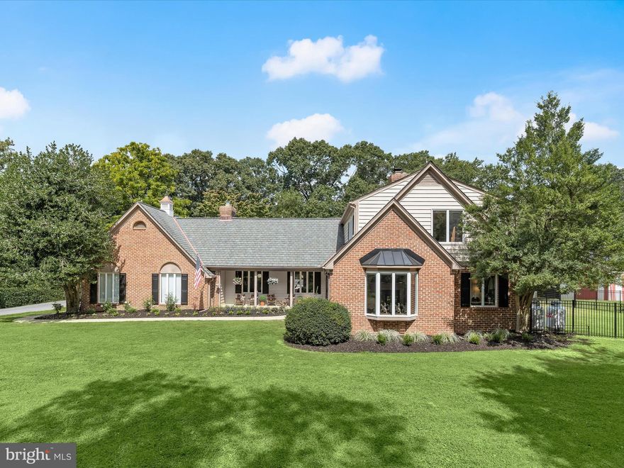 Set on 25 picturesque acres with a meandering creek, this world-class equestrian estate offers an unparalleled blend of professional horse facilities and refined country living—all within an easy drive of Washington D.C., Baltimore, and Northern Virginia. Designed with precision, care, and comfort in mind, the property is turnkey for the serious equestrian, trainer, or discerning private owner.  At the heart of the farm are two exceptional barns, totaling 45 stalls, thoughtfully designed for safety, convenience, and efficiency. The main barn boasts 29 matted stalls across two wide 12-foot aisles, each equipped with its own fan, light, and timed outlet. Amenities include a climate-controlled lounge, two spacious tack rooms, a wash stall, an insulated laundry room, a utility room, and a massive loft with guest accommodations. Dedicated farrier lighting and ample tractor clearance make daily operations effortless. Just steps away are an indoor arena, a large shavings shed, an additional 7 stalls, and a hay storage container that keeps dust to a minimum.  The second barn offers 9 matted stalls, a charming guest room, a full bath, and a two-bedroom suite ideal for visiting riders or staff. A vehicle lift in the barn provides space for on-site equipment maintenance.  For the rider, the property features a large indoor arena with sand footing and lighting, powered by a leased solar panel array with five inverters in the attached workshop. Outdoor training spaces include a 175’ x 275’ arena with new footing, a 48-foot covered round pen, and a 4-horse ProWalk hot walker. Pastures are immaculately maintained, enclosed by safe wood fencing, and laid out for ease of rotation and turnout.  Additional accommodations include a caretaker’s cottage and barn apartment, both updated for comfort and practicality.  The four-bedroom main residence blends casual elegance with warmth, featuring hardwood floors, two gas fireplaces, a great room with brick-surround fireplace, cathedral ceilings,  and skylights, a formal dining room with built-ins, crown molding,  and designer lighting, and a main-level primary suite with the flexibility to expand. The updated kitchen with island and stainless steel appliances, granite counters,  opens to light-filled living spaces, and the unfinished basement with rough-in offers room to grow. The upper level provides three spacious bedrooms, one with an en-suite bath with a soaking jetted tub, a walk-in shower, and a walk-in closet.   Outdoor living is elevated by a newly remodeled heated inground pool with fountains, new tile and plaster, a sun deck, and a covered patio surrounded by lush perennial gardens.  Additional amenities include a Two-car attached garage with EV charger, an RV garage with 16-foot ceilings, 14-foot doors, and 100-amp service, designed for Class A RVs, large living quarter horse trailers, or future conversion to a gym, basketball court, breeding facility, or stallion station.  Every detail of this estate, from the safe fencing to the solar power, from the manicured arenas to the luxurious living quarters, has been crafted for the ease of care and enjoyment of horse and rider alike. With proximity to top equine veterinary hospitals and premier showgrounds, this is a rare opportunity to own one of Montgomery County’s finest equestrian properties. Shown by private appointment only.