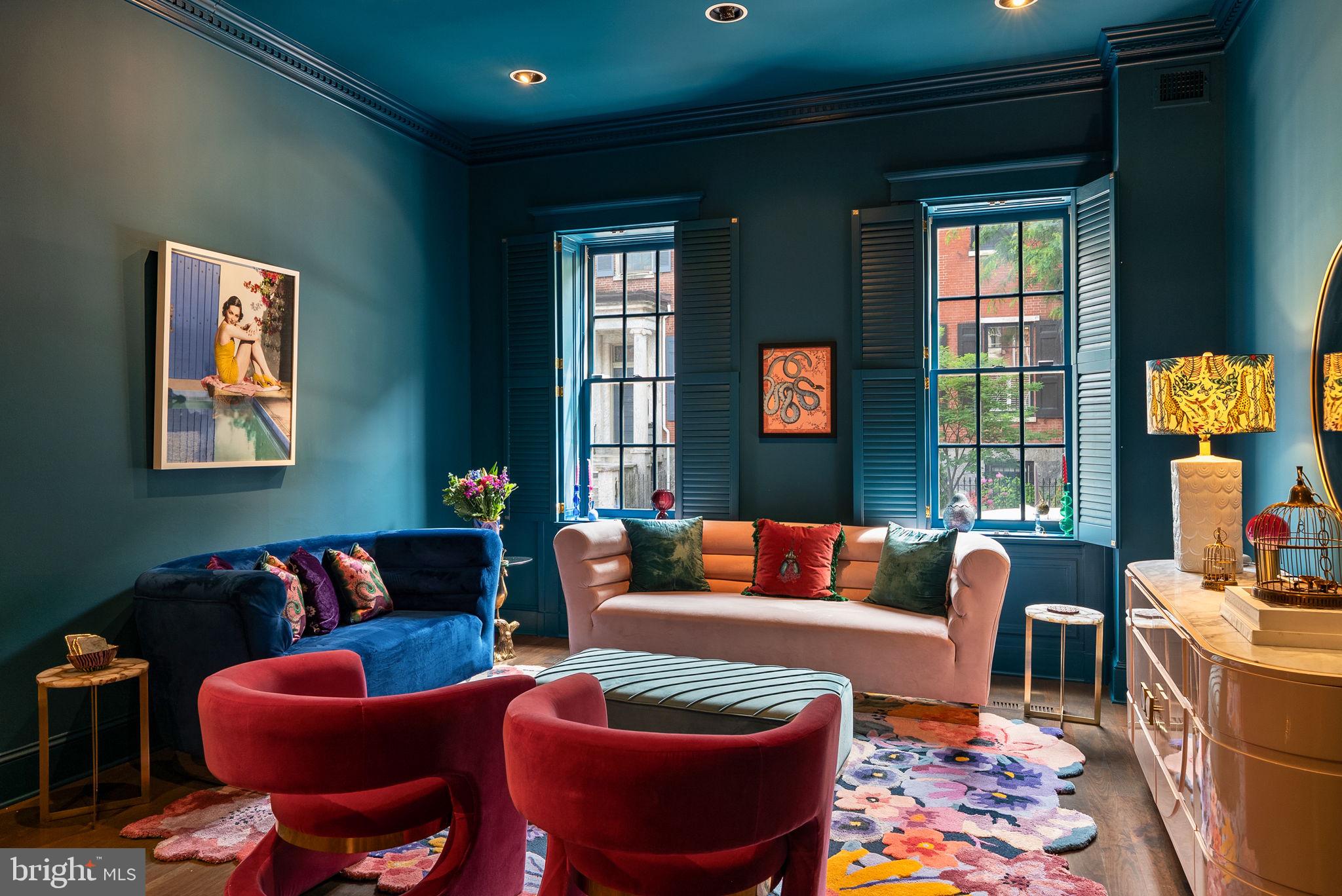 Welcome to 913 Spruce Street in storied Washington Square West. This 20-foot-wide historic townhome with an attached 2-car garage spans over 4,500 SF across five levels of living and has been refreshed by the current owner. Enter through a vestibule into a gracious hall with arched doorways into the formal living room and dining room, with French doors leading out onto a brick-enclosed courtyard. The eat-in kitchen with high-end stainless appliances, ample cabinetry, and a gas fireplace has an additional entrance to the courtyard and the 2-car garage. There is also a conveniently located powder room on the first level. The second-level family room features built-ins, a fireplace, and double glass doors to a serene terrace - perfect for outdoor enjoyment and entertaining. Adjacent to the family room is a hall bathroom with a pedestal sink, vanity area, and bathtub/shower combo.
The primary suite is in the front of the second level and includes a spacious bedroom with high ceilings, a walk-in closet, an en-suite bathroom with two vanities, a glass-enclosed shower, and an oversized jetted tub. Two guest bedrooms with a jack-and-jill marble-tiled bathroom are located on the 3rd level of the home, and an additional bedroom with lofted ceilings is located on the 4th level of this grand home. The finished lower level offers a large laundry room, recreation room, temperature-controlled wine cellar, powder room, and storage. This prime Society Hill location is a short stroll to Pennsylvania Hospital & Jefferson Campus, Washington Square Park, Avenue of the Arts, Whole Foods, Acme, and many neighborhood favorite restaurants and retail. Located in the McCall Elementary School Catchment.