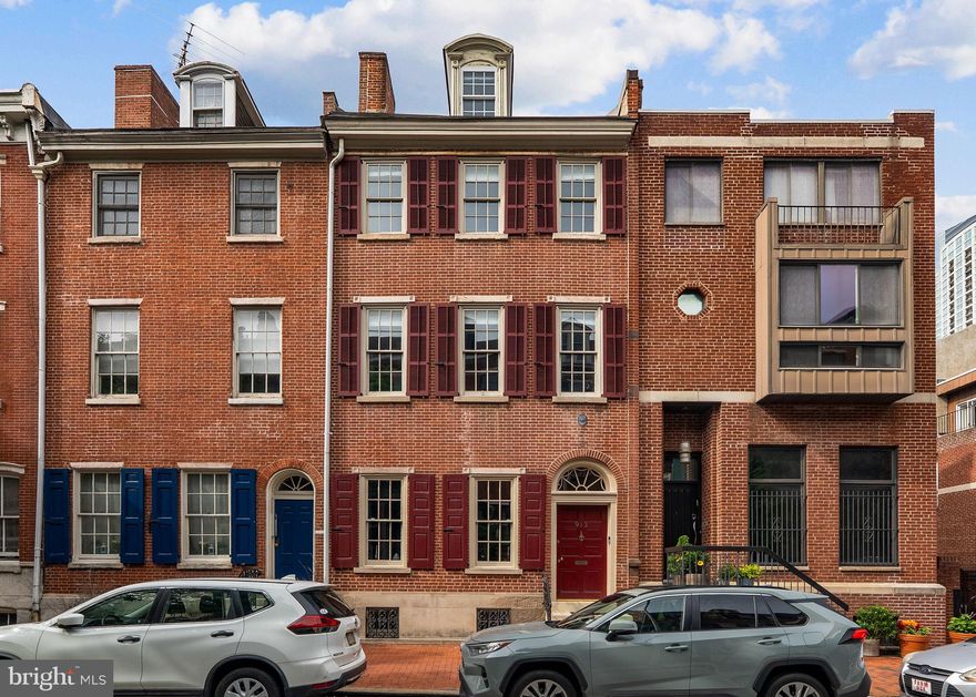 Welcome to 913 Spruce Street in storied Washington Square West. This 20-foot-wide historic townhome with an attached 2-car garage spans over 4,500 SF across five levels of living and has been refreshed by the current owner. Enter through a vestibule into a gracious hall with arched doorways into the formal living room and dining room, with French doors leading out onto a brick-enclosed courtyard. The eat-in kitchen with high-end stainless appliances, ample cabinetry, and a gas fireplace has an additional entrance to the courtyard and the 2-car garage. There is also a conveniently located powder room on the first level. The second-level family room features built-ins, a fireplace, and double glass doors to a serene terrace - perfect for outdoor enjoyment and entertaining. Adjacent to the family room is a hall bathroom with a pedestal sink, vanity area, and bathtub/shower combo.

The primary suite is in the front of the second level and includes a spacious bedroom with high ceilings, a walk-in closet, an en-suite bathroom with two vanities, a glass-enclosed shower, and an oversized jetted tub. Two guest bedrooms with a jack-and-jill marble-tiled bathroom are located on the 3rd level of the home, and an additional bedroom with lofted ceilings is located on the 4th level of this grand home. The finished lower level offers a large laundry room, recreation room, temperature-controlled wine cellar, powder room, and storage. This prime Society Hill location is a short stroll to Pennsylvania Hospital & Jefferson Campus, Washington Square Park, Avenue of the Arts, Whole Foods, Acme, and many neighborhood favorite restaurants and retail. Located in the McCall Elementary School Catchment.