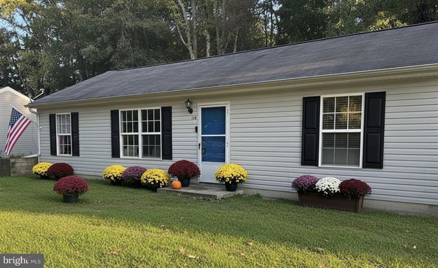 One level living on a quiet street that ends at two woods.