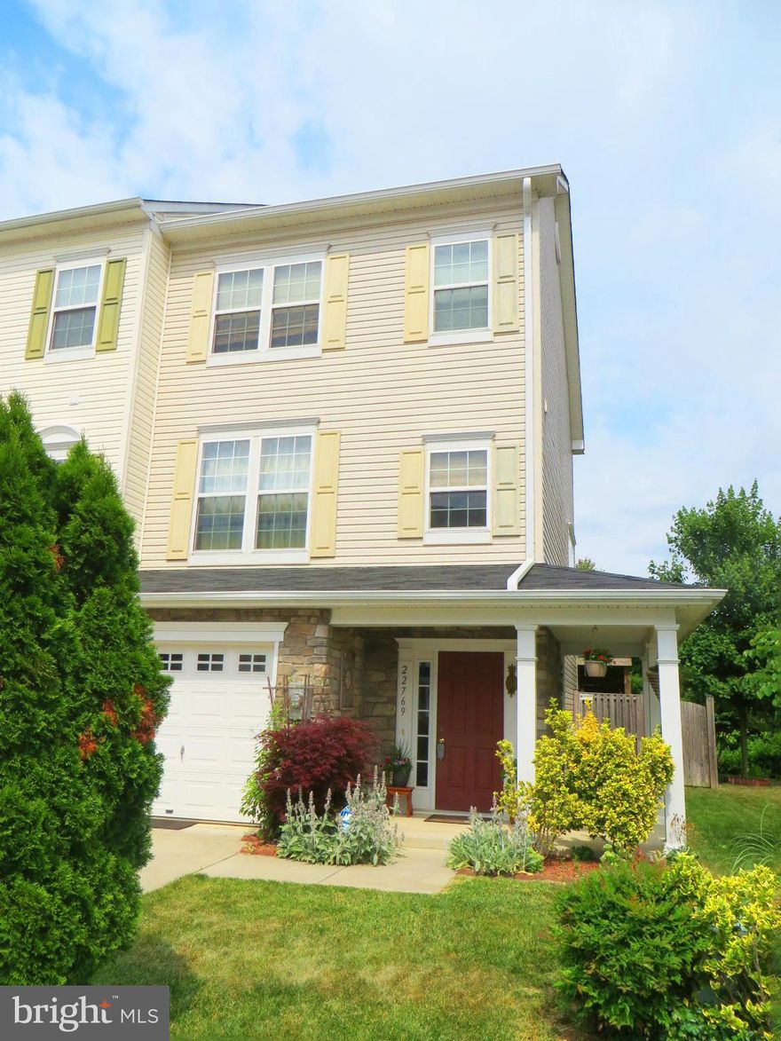 Bright end unit with upgrades galore! Entry level has engineered flooring, FR (could be 4th BR) with wet bar & built-ins, inc Murphy bed; full bath. Hdwd stairs to mid-level w/spacious LR & KT/DR w/new fridge, microwave, lighting. Upper level has MBR w/WIC, nice bath. 2nd & 3rd BRs w/connecting door. Deck w/retractable Sunsetter awning, garage, fenced yard, wrap porch, landscaping, backs to trees!