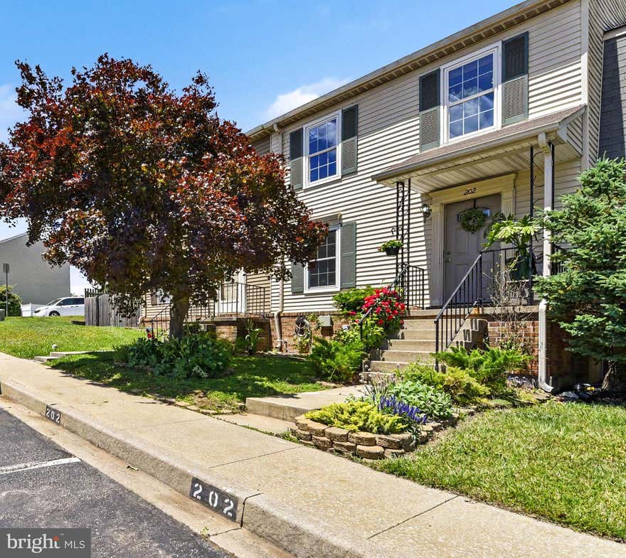 This pristine, updated townhome truly shows pride of ownership, featuring a beautifully landscaped front yard with fragrant flowers, herbs and a welcoming front porch. The main level features spacious living and dining areas with easy-to-care-for laminate wood floors. The updated kitchen features luxury vinyl plank flooring, a ceiling fan, and a convenient breakfast bar. Upstairs, you will find three large bedrooms, all with ceiling fans, the primary bedroom includes a private half bath and walk-in closet. The lower level offers a versatile recreational room—currently used as a fourth bedroom—complete with a full bath, a finished storage room, and a large laundry room. Notable features include a whole-house water filtration system, fresh insulation in the attic, gutter guard filter system and a fenced backyard with a large deck, a play area, and a low maintenance garden with miniature apple trees,  berry bushes & herbs. There is also a 10' x 8' shed under the deck for additional storage. Open House Weekend, Saturday June 6th 1-3 and Sunday June 7th 1-3.
