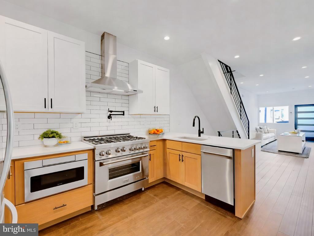 Back on the market and better than ever—this fully reimagined 3-bedroom, 2-bath home in the heart of Passyunk Square offers 1,700 square feet of modern living and thoughtful upgrades, now attractively priced at $629,000. Every inch of this home has been rebuilt, including a stunning third-floor addition that leads to a private rooftop deck with sweeping city skyline views. Inside, you'll find an open-concept layout with designer finishes, a sleek and functional kitchen, and smart home features like energy-efficient systems and an advanced security setup. The home also includes central heating and air, a spacious basement ideal for storage or future flex space, and a peaceful private backyard—perfect for entertaining or relaxing.
Ideal for both local buyers looking to upgrade and out-of-area transplants seeking more space and value, this home offers a rare combination of lifestyle and location. Just steps from Passyunk Avenue's award-winning dining, boutique shopping, and vibrant community energy, it's the best of city living with a neighborhood feel. Street parking adds convenience, and this home also qualifies for the NeighborFirst program—featuring low down payments, no PMI, discounted rates, and no credit score penalties.
Whether you're a first-time buyer, an investor, or relocating from New York or North Jersey, 702 Dickinson St delivers unbeatable quality, style, and value in one of Philadelphia’s most sought-after neighborhoods.
Home is decorated with AI