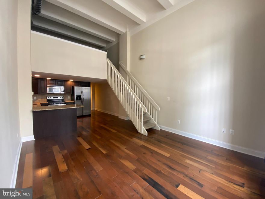 This incredible 1BR / 1.5BA Loft Apartment offers top notch Amenities INCLUDING PARKING, Fitness Center, 24/7 Front Desk Service and more!

The focal point of the Living Room is the huge arched window which allows in tons of natural light, but also keeps out the noise. There is a Modern Kitchen with Granite Countertops, Modern Appliances, Hardwood Flooring and Washer & Dryer along with a Half Bath on the 1st Floor. Walk upstairs to the open Loft Bedroom with Walk-in Closet and nice size Bathroom.

One car PARKING spot INCLUDED in COVERED GARAGE!

Get your workout on in the Fitness Center that includes hot tubs, saunas and locker rooms.

The Marine Club is conveniently located at the Corner of Washington Ave and S. Broad St. It is across the street from Lincoln Square which features, Sprouts Farmers Market, Target, Starbucks, Wine and Spirits and much more!

Accessible to the BSL and Septa Buses, The Italian Market and East Passyunk and so much more! Center City with its many shopping districts & Arts and Entertainment. I-76, I-95 and the Walt Whitman Bridge are minutes away.
- PETS AT OWNERS DISCRETION/Case-by-Case. - Tenant pays Electric-Gas-Water