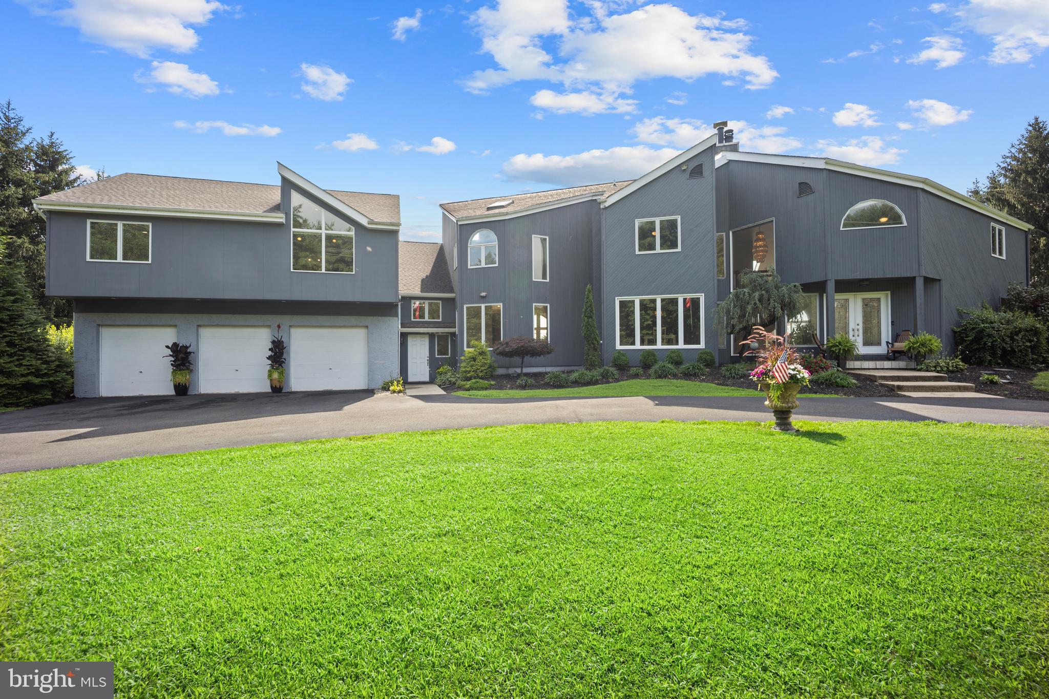 Experience modern luxury in this custom-built 5-bedroom, 3 full baths & 2 half baths masterpiece nestled on over 3 acres in scenic Pipersville. Spanning 5,345 sq ft, this show-stopping home features an open, light-filled floor plan, rich hardwood flooring throughout, and panoramic long-distance views from multiple decks. The resort-style backyard boasts an inground pool and expansive entertaining spaces, which include 4 decks —perfect for summer gatherings.
A rare 1,000 sq ft in-law suite with private elevator access, full kitchen, and separate living quarters offers the ideal setup for multigenerational living or guests. The oversized 3-car attached garage, brand-new barn-style shed, and generous lot provide endless space for storage, hobbies, and future expansion. Located in the desirable Palisades School District, this stunning retreat combines sleek design, privacy, and functionality—an exceptional opportunity for luxury living in Bucks County.