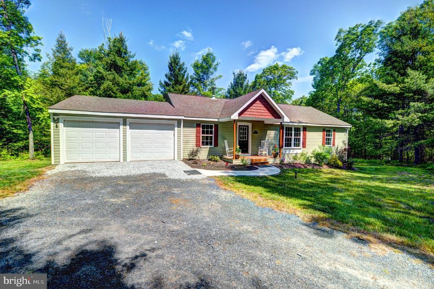 Spacious wide open floor plan.  Stunning private lot with beautiful natural landscaping in private back yard.  28x16 custom deck with built-in hot tub. Brazilian teak wide plank hardwood throughout. Top of the line Stainless Steel appliances. Oil Rub Bronze Fixtures and hardware (all the way to the door hinges). Gourmet Kitchen with Tier 4 Jaguar Granite and Full Overlay Maple Cabinets. Built-in 30 Cubic Foot  French Door Refrigerator and Microwave. Samsung 5 Burner CookTop with Convection Oven.  Super Capacity LG washer & Dryer with Steam. Custom trim package with 2 piece chair rail, extra large base moldings, custom window & door trim, architectural ceiling.  Super Energy Efficient monthly bill is less than$40. R60 in ceiling- R21 in Walls-R38 in floor.  Insulation padding under hardwood floors.  Pella windows. All LED lighting. High efficiency Heat Pump (and AC) with 10KW back-up strip heater. Wood burning stove with full glass view. Stand alone built-in Humidifier.  Tankless hot water heater. Whole-House carbon water filtration system. 400 AMP Electricity. Hot water tap for Hot Tub—fill it in 90 minutes ready to go at 104 F.  Laundry Tub In Garage with Hot & Cold water.  Prewired for back-up generator.  SMART HOUSE---- wifi Thermostat--  wifi Smart Switch Lights--  wifi garage doors--  4K surveillance system w/ 2 way audio and remote access.  Control any of these from anywhere in the world.  Turn the heat up when you leave Baltimore—house is warm when you get there.  4 built-in ceiling speakers to complete 7.2 Dolbly Atmos surround sound. Built-in deck Speakers, Subwoofer, Sony AMP. Underground Dog Fence.  Great location – convenient to all the deep creek hot spots and still close to Oakland shopping.