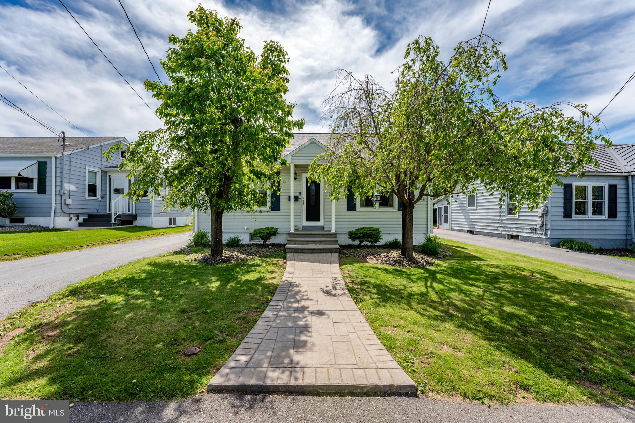 This charming cape cod is the perfect place to call home. Recently updated eat in kitchen with Luxury Vinyl Plank flooring leads into a spacious living room. Also on the main level are the primary bedroom, main bathroom and another bedroom. Upstairs features 2 additional bedrooms. New HVAC system installed in 2024. Laundry is located in the unfinished basement with a half bath. In the rear of the home, you will be greeted by a beautiful, covered patio with decorative stamped concrete. In addition there is a stamped concrete walkway that leads to the front door giving this home fantastic curb appeal. Paved driveway leads to a heated large(30x36) garage that is located in the back of the house. This home also features a new roof which is approx. a month old. Also, this home is within walking distance to the playground.