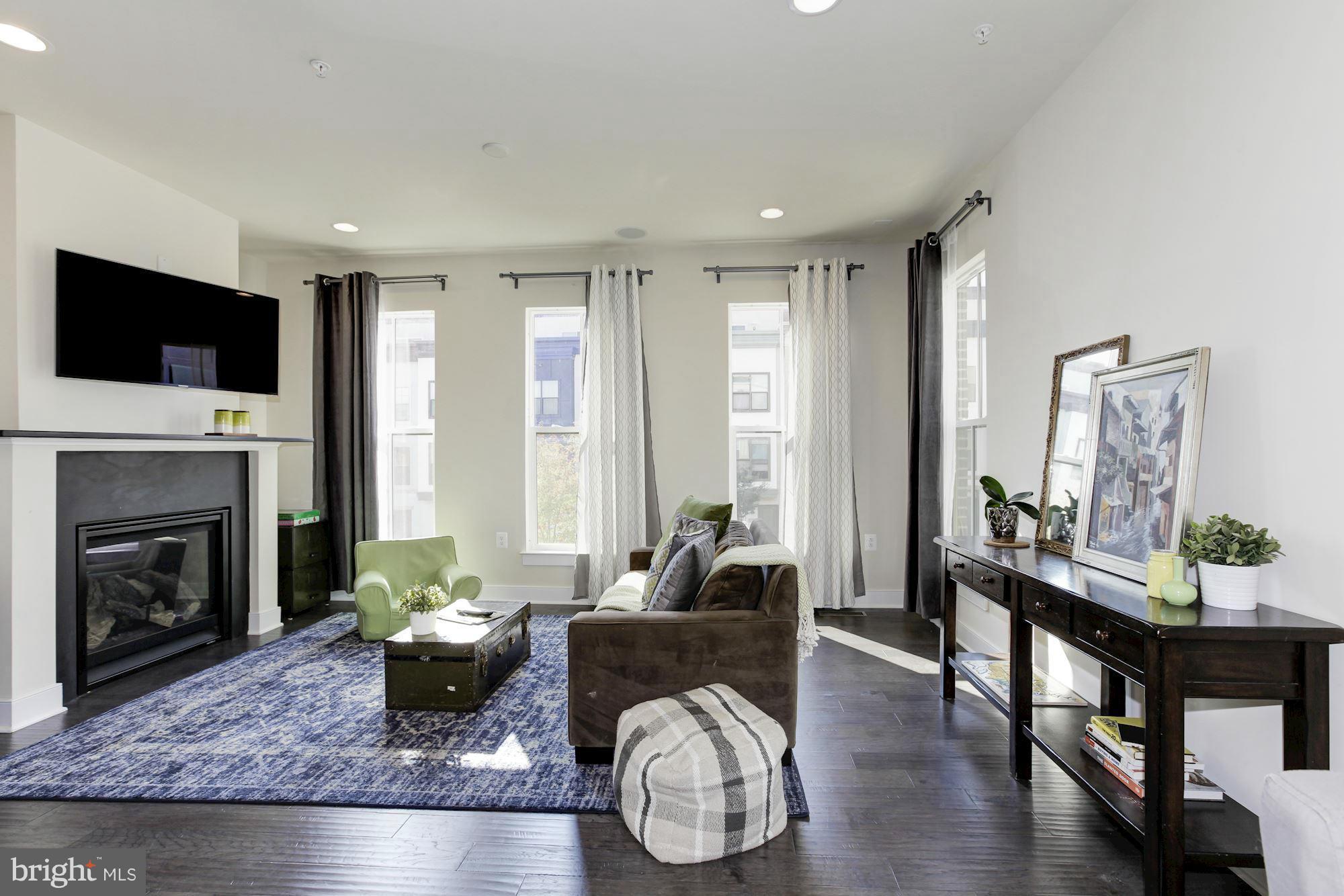Rare-to-find 4BR corner townhouse it Arts District of Hyattsville! Gorgeous roof deck, spacious open floor plan, large kitchen, ample light, beautiful 4th floor living area w/ guest suite, large balcony and views! Two car garage, gym and pool memberships included in monthly rent. Shuttle to metro! Walking distance to restaurants, shopping and Yes Organic market!