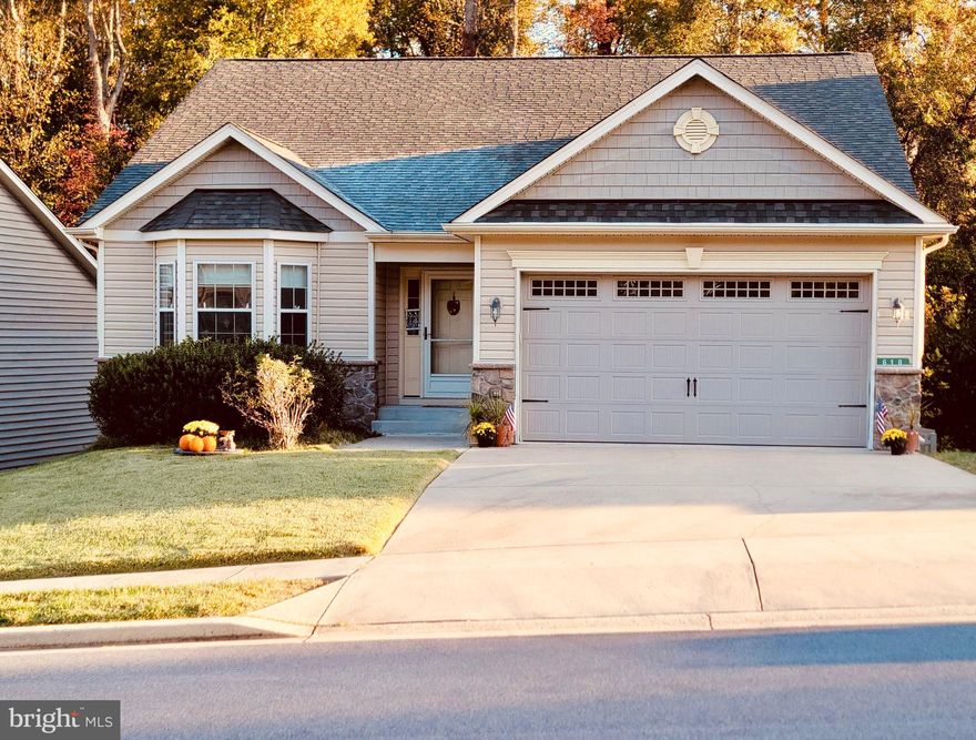 Rare opportunity to buy in the sought-after Southgate community in Prince Frederick! One of the LARGEST homes you'll find in an over 55 community!  This gorgeous home has over 1,600 sf with 3 bedrooms, 2 full baths --- plus a FULL, UNFINISHED BASEMENT with rough-in for a third full bath where you could easily double your living space! Basement has extra windows added when built so it has lots of natural light and sliders that lead to the fenced backyard.  The generous lot size of .19 back up to trees/woods for added privacy.  Primary ensuite has very large bedroom with a walk-in-closet and large bathroom with double vanities. Kitchen has table space and tons of counter space and honey maple cabinets, plus a pantry--so plenty of storage for owners who like to cook.  Kitchen has all stainless steel appliances, including built-in microwave, dishwasher, electric range, and extra large refrigerator with freezer drawer. Spacious living room has a gas f/p and has and additional dining area with sliders that lead to deck overlooking the backyard. Full size laundry closet is on main level for easy access. Lots of extra closet space,  and a 2-car garage. This super friendly, safe community is very active where neighbors get together for social activities.  Fantastic location near hospital, grocery stores, shopping, movie theater and restaurants!!!