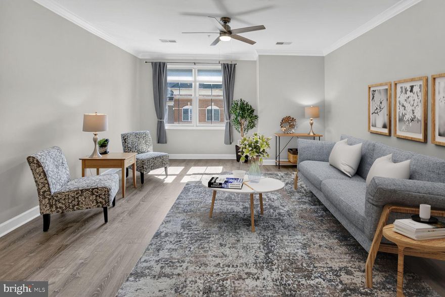 Move right into this sun-filled, southern-facing two-level condo that lives like a townhome while offering the ease of low-maintenance living—perfectly perched above the vibrant shops and restaurants of King Farm Village Center in Rockville. Freshly painted and beautifully refreshed, this home shines with brand-new Luxury Vynel Plank flooring and an open-concept main level filled with natural light.

The stylish kitchen is both functional and inviting, featuring granite countertops, stainless steel appliances, under-cabinet lighting, and a breakfast bar with abundant storage. The open dining and living areas flow seamlessly together, creating an inviting, spacious setting that’s perfect for entertaining guests or enjoying everyday living. A well-appointed powder room with upgraded features completes the main level.

Upstairs, two generously sized bedrooms each offer renovated ensuite baths with designer tile, vanities, lighting, and fixtures—creating ideal privacy for guests, roommates, or a home office setup. The upper-level laundry adds everyday convenience, and the thoughtful two-level layout provides comfortable separation of living and private spaces.

This boutique building (just 25 residences) offers a quiet, well-maintained atmosphere along with amenities including assigned parking, private storage, bike storage, a fitness center, and a community room. As part of the highly desirable King Farm community, residents enjoy access to pools, parks, playgrounds, sports courts, and a free shuttle to Shady Grove Metro—plus walkable access to Safeway, dining, coffee shops, and everyday conveniences just steps from your door.

With easy access to Route 355, I-270, I-370, NIH, and the Metro, this location is ideal for commuters while delivering a true live-work-play lifestyle. Rarely available two-level layouts like this offer larger square footage and exceptional value—making this not just a beautiful home, but a smart investment in one of Rockville’s most dynamic and walkable communities.