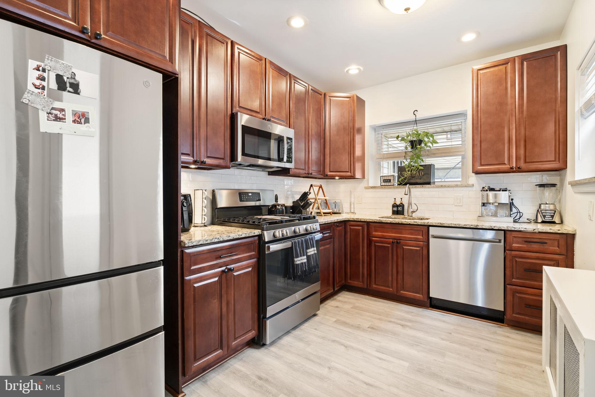 Step inside this stunning Fishtown home to find magnificent wood floors throughout the first floor, where you'll enjoy a generous living room and a formal dining room—perfect for entertaining. A beautifully tiled full bathroom with a large custom shower also sits conveniently on the main floor.
The updated kitchen is a chef's dream, featuring granite countertops and modern stainless steel appliances with a door leading to the large backyard, which provides ample room for barbecuing or simply relaxing in your private outdoor space. Upstairs, you'll find three spacious bedrooms and a second fully renovated bathroom with elegant tile work and fixtures. This home is located in a prime neighborhood with high walkability and is close to public transportation, major highways, shopping, popular gastro pubs, eateries, entertainment, and so much more. Don’t miss this opportunity to live in one of Philly’s most vibrant and growing communities!