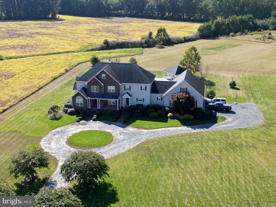 Experience luxurious country living on 42 beautiful acres with this 5-bedroom, 4-bath custom-built home offering 4,600 sq. ft. of refined living space. This stunning property features hardwood floors, a dining room, a spacious formal living room ideal for entertaining and a front room study to enjoy the views.  The gourmet kitchen is a chef’s dream, boasting an oversized island, professional-grade Viking appliances, and a bright eat-in area that opens to a large family room with a gas fireplace.  The first-floor owner’s suite offers a private retreat with double walk-in closets, a spa-inspired luxury bathroom featuring dual sinks, an extra-large custom walk-in shower and whirlpool tub. Private door exits the suite to offer relaxing by the pool or enjoy the amazing patio.  Four additional bedrooms are equally spacious, each with large walk-in closets and access to full Jack and Jill bathrooms for privacy and convenience.  One of the larger bedrooms offers a "sitting room/study".  Upstairs offers an extra-wide hallway overlooking the downstairs foyer.  Mudroom conveniently located with full bath offering access from the garage, secondary deck and pool.  Above the garage offers 600 sq. feet of additional space (not included in sq. footage) to convert into a mancave, extra living space, theater room, gym, art studio, home office or extra guest quarter.  (rough plumbing, HVAC lines make it easy to install additional bathroom).  The home also features a large third floor bonus room with walk-up stairs (can be converted to additional living space with minor modifications).  The three-car garage is drywalled and insulated with 15-foot ceilings and 9-foot-tall garage doors with high track lift openers.   Outdoor amenities include a sparkling inground pool, expansive pool deck, secondary vinyl deck, pool house and an over-sized screened porch perfect for relaxing or entertaining. The property provides a unique oasis with privacy, scenic views, and ample space for recreation, horses, or future expansion.   Many upgrades such as a four zone Geothermal heating and cooling, tankless water heater, custom built touches and much more.  This extraordinary home combines luxury, comfort, and tranquility — a rare find on 42 acres with private pond.  This estate perfectly located minutes from Salisbury University, Tidal Health, shopping, dining and 40 minutes from the amazing Ocean City beaches.  This estate is a "one of a kind" and the potential is endless.  MUST SEE to appreciate.