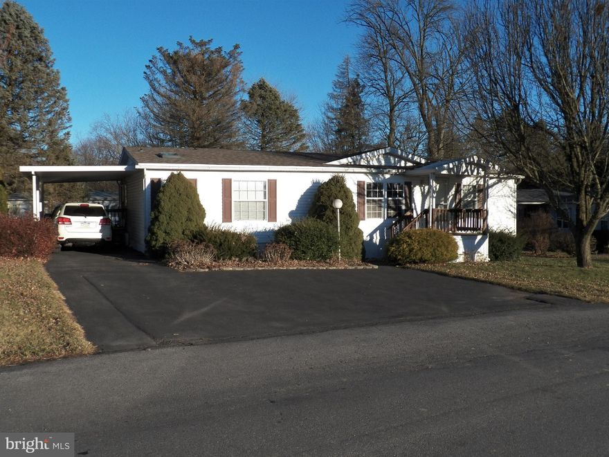 Very well maintained 2000 Liberty manufactured home situated in the Green Acres Mobile Home Community. The exterior features an attached carport, paved parking, a covered from porch and a nice private yard w/storage shed. As you enter, you're greeted by a spacious living that opens up to a formal dining room. The modern kitchen features a bar area, plenty of cabinet space and an entire set of newer appliances. Off of the kitchen there's a breakfast nook and a laundry area that also features a newer washer/dryer! The master bed is highlighted by a large master bath with 2 vanities, soaking tub and a shower. There are two additional bedrooms w/ample closet space and a second modern full bathroom. Additional Features include : Newer custom blinds throughout the home, a water softener, all new skylights, Parkland Schools and close proximity to shopping/restaurants.