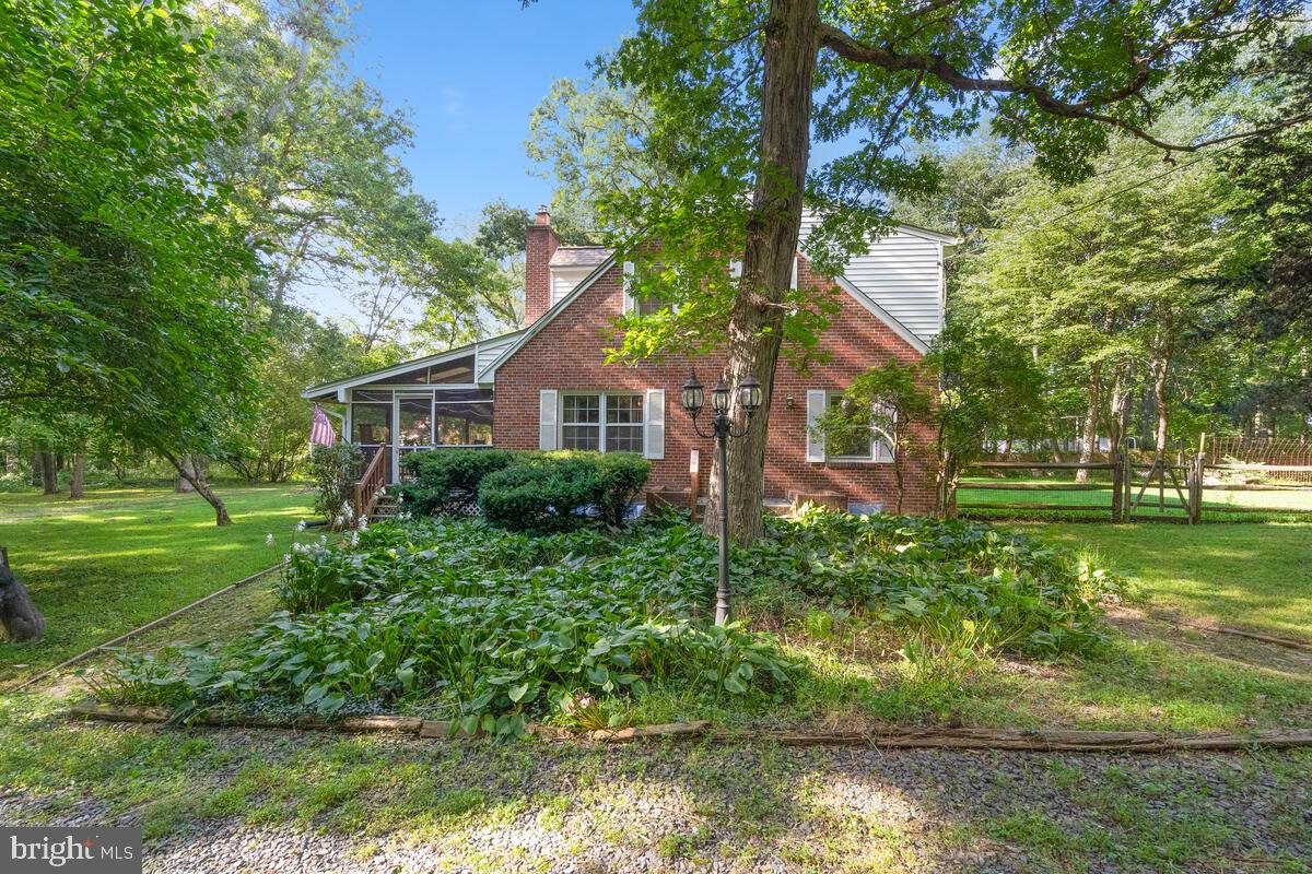 Welcome to this distinctive and elegant Colonial nestled on over 3 acres near the heart of historic Brookeville and surrounded by acres of hiking and equestrian trails. This home has been meticulously maintained by the current owner and features 6 bedrooms, 4 full baths, rich custom wood moldings, gleaming wood floors throughout and 3 fireplaces, one with a wood burning stove with blower. The formal living and dining rooms offer the perfect backdrop for elegant and sophisticated entertaining. The main level also features an office/bedroom, full bath and newly updated kitchen with Viaterra engineered stone/quartz counters, new under mount sink, new disposal, new faucet, new cabinet lights & newly installed heavy gage pull out shelves. Just off the living room is your huge screened-in porch where you can relax and enjoy beautiful wooded views. Upper level features the owner's suite with a walk-in closet and updated private bath with custom tile, new tub, new faucet fixtures & ceiling fan. Three additional bedrooms and an additional updated full bath complete the upper level. The finished lower level includes a 6th bedroom, full bath, kitchenette, dining area, living room with a wood burning fireplace and utility room, perfect for guests. A new roof, new gutters, back up generator, whole house attic fan, external GFCI outlets, exterior motion monitor light fixtures and a 1 acre fenced yard complete this amazing home!