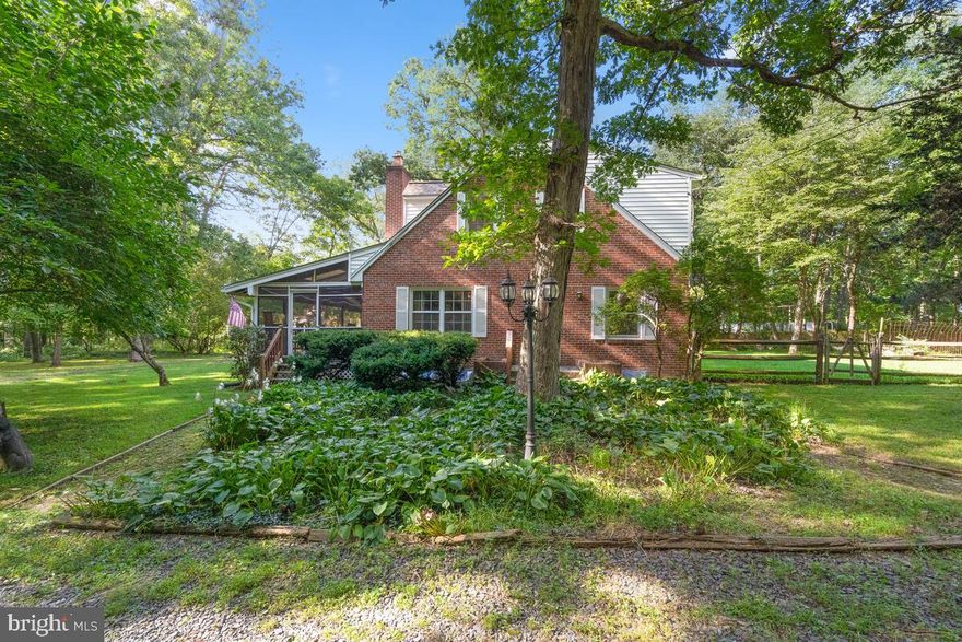 Welcome to this distinctive and elegant Colonial nestled on over 3 acres near the heart of historic Brookeville and surrounded by acres of hiking and equestrian trails. This home has been meticulously maintained by the current owner and features 6 bedrooms, 4 full baths, rich custom wood moldings, gleaming wood floors throughout and 3 fireplaces, one with a wood burning stove with blower.  The formal living and dining rooms offer the perfect backdrop for elegant and sophisticated entertaining.  The main level also features  an office/bedroom, full bath  and  newly updated kitchen with Viaterra engineered stone/quartz counters, new under mount sink, new disposal, new faucet, new cabinet lights & newly installed heavy gage pull out shelves.  Just off the living room is your huge screened-in porch where you can relax and  enjoy beautiful wooded views.  Upper level features the owner's suite with a walk-in closet and updated private bath with custom tile, new tub, new faucet fixtures & ceiling fan. Three additional bedrooms and an additional updated full bath complete the upper level.  The finished lower level includes a 6th bedroom, full bath, kitchenette, dining area, living room with a wood burning fireplace and utility room, perfect for guests.  A new roof, new gutters, back up generator, whole house attic fan, external GFCI outlets, exterior motion monitor light fixtures and a 1 acre fenced yard complete this amazing home!