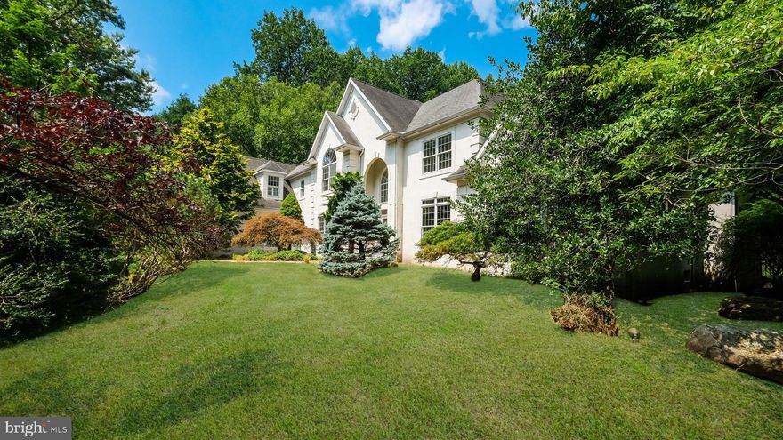 Don't miss this custom built 6,465 sq. ft. above grade  Zaveta home offering 5 bedrooms, 5.5 baths located in the highly desirable neighborhood of Ash Mill.  This stunning home is nestled in a tranquil private 2.07 acre  setting with a private stream & beautiful in-ground pool surrounded by lush landscaping .  The home immediately wows you showcasing a grand 2 story foyer accented with marble floors, leaded glass doors & a demi-lune window above. The foyer is flanked by a formal dining room with triple windows & French doors, along with a elegant library with a fireplace.  Off of the library sits a quiet office with  peaceful  views of the grounds. The gracious living room features a 2-story barrel ceiling with glass doors leading to a rear deck overlooking the garden & pool area. The open family room has oak floors, & a  handsome stone fireplace. The kitchen is light & bright with granite countertops, extensive white cabinetry, & top quality SubZero refrigerator.   The kitchen also  has a counter gathering/sitting area along side a spacious breakfast room.  The main floor primary bedroom suite overlooks the garden and includes a gas fireplace. The ensuite bath features a whirlpool tub, oversized shower, marble flooring & a double vanity with a granite countertop. To top of the main floor there is an oversized laundry room. On the 2nd level you will find 4 more generously sized bedrooms & 3 more full baths, including 2 private suites.  The approx. 2000 sq. ft. lower level is finished offering a workout room, gathering room with a bar, bonus room and utility room with a workshop & storage area. There are 2 entries to the basement, one through the house and one through the garage. There is a full bath & sauna in the basement that is not quite complete yet but the tile is there to install and to  finish with your special touches. There is an oversized rear deck framing the beautiful views of the rear exterior including the pool, stone waterfall, lush gardens & pergola. Additional extras include a emergency generator, oversized garage and storage shed. The home has a great commute to route 202 taking you to all the commuter destinations. Award winning Central Bucks Schools. Literally just minutes from fine dining & shopping in Doylestown, New Hope & Newtown.   Schedule an appt. ASAP!! Easy to show.