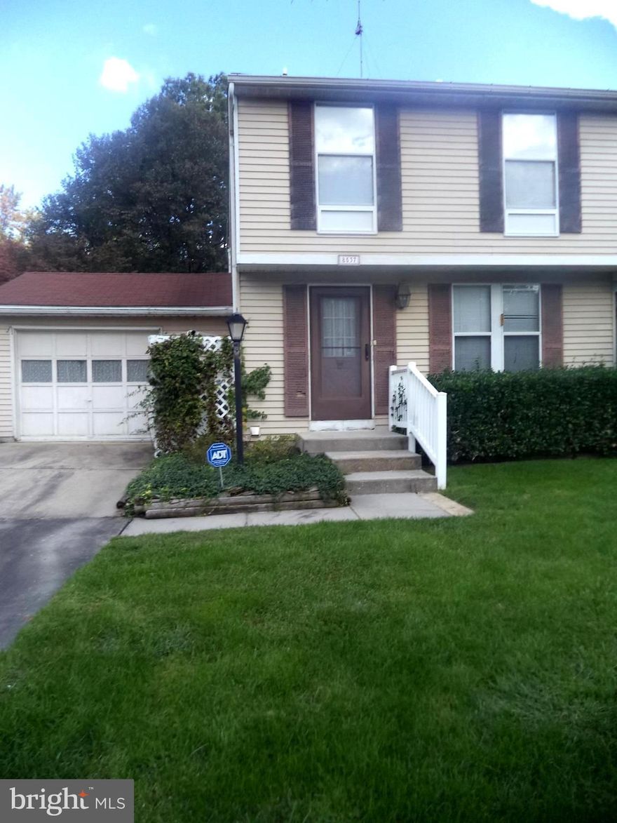 Wow, an attached remote access garage and large level corner lot, semi-detached home priced below market value for quick sale. Plenty of parking for upcoming holiday visitors. Screened patio on back of home. Convenient to I95, 695, shopping/entertainment. Can be converted to 3 Bedrooms. Motivated seller is providing a One Year AHS Shield Plus home warranty for the buyer.