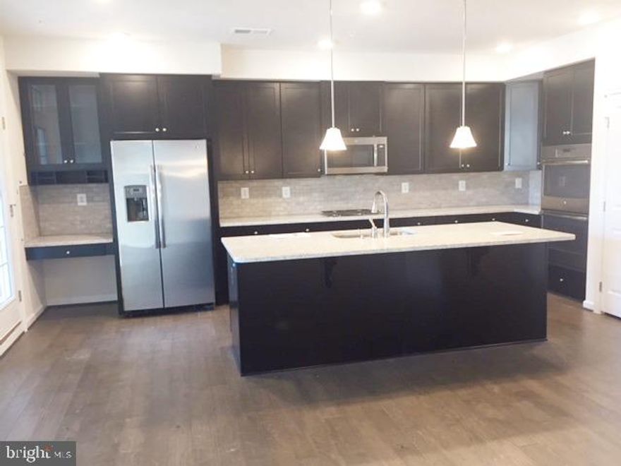 Immaculate, Luxurious , Well maintained  3 Bed 2.5 Bath 1 Car Garage UPPER LEVEL  PICASSO MODEL  Townhome / condo!    WATER included in Rent.  MAIN LEVEL Features : Beautiful Gourmet Kitchen with Granite Counter Top, Stainless Steel Appliances , Family Room Off Kitchen, Living / Dining Combo.  Relaxing Balcony,  Hardwood floors on entire Main level. UPPER LEVEL Features : 2 Decent Size Bedrooms with closets,  ** Tray Ceiling in Spacious Master Bedroom **, Spacious His & Her Walk In Closet. MASTER BATH Features :  Soaking Tub, Standing Shower, His & Her Vanity.   Close to restaurants & shopping, convenient access to Dulles Metro Rail,commuter routes and Airport.  Available from April.