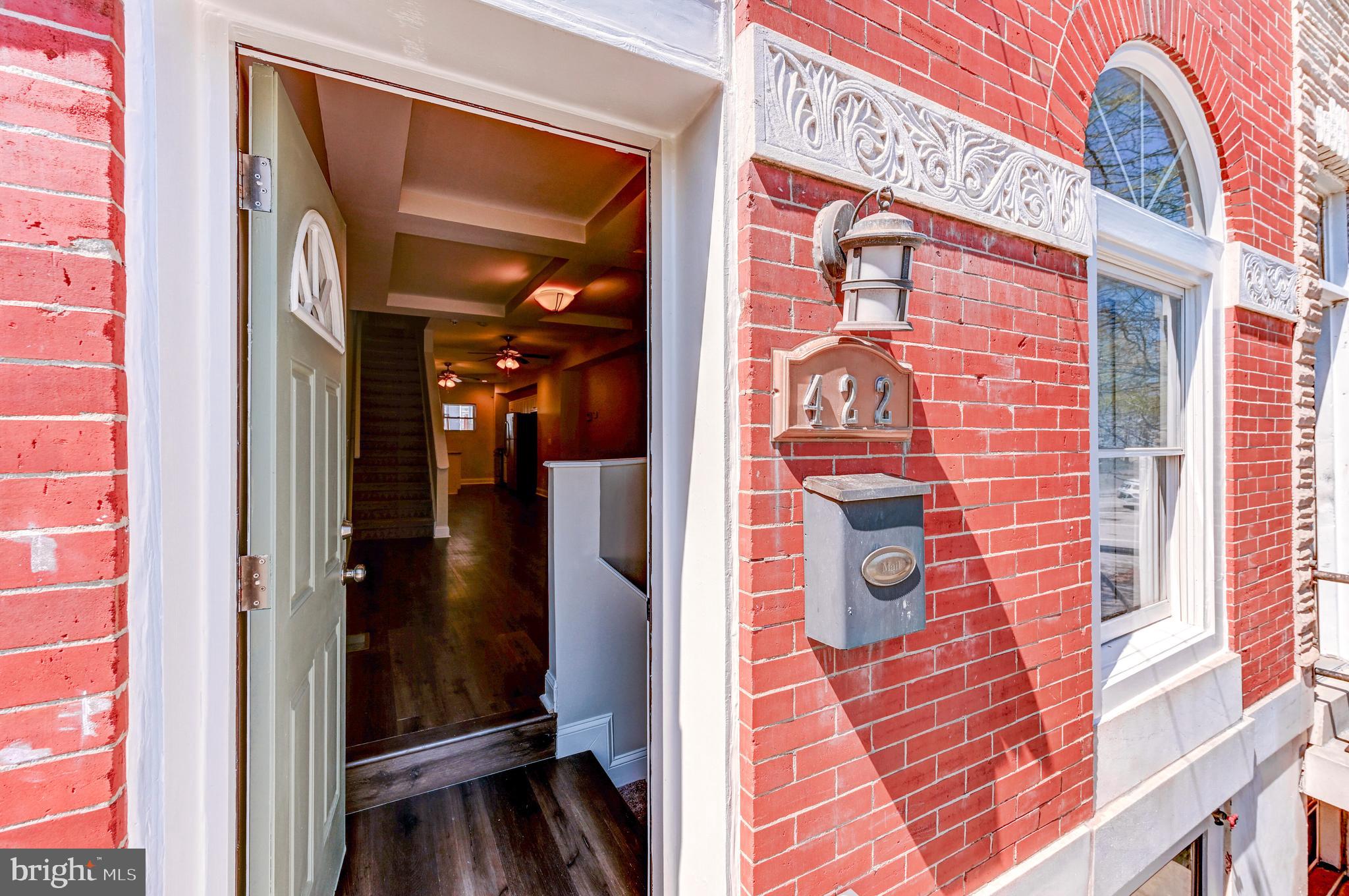 Welcome to 422 N Luzerne Avenue, a beautifully updated 2-bedroom, 2.5-bath brick-front rowhome in East Baltimore offering the perfect blend of historic charm and modern updates. Enjoy the convenience of angled parking right out front, then step inside to an open, light-filled layout with updated flooring, stylish fixtures, and neutral finishes throughout. The modern kitchen features granite countertops, stainless steel appliances, and ample cabinet space, while upstairs you’ll find two spacious bedrooms each with a private full bath, including a rear bedroom with balcony access. A private fenced backyard provides the perfect spot for entertaining, pets, or relaxing outdoors. Located just minutes from Johns Hopkins Hospital, Patterson Park, and a short ride to Canton’s waterfront, shops, and restaurants, this move-in ready home offers comfort and convenience in a prime location. Home is being sold AS IS.
