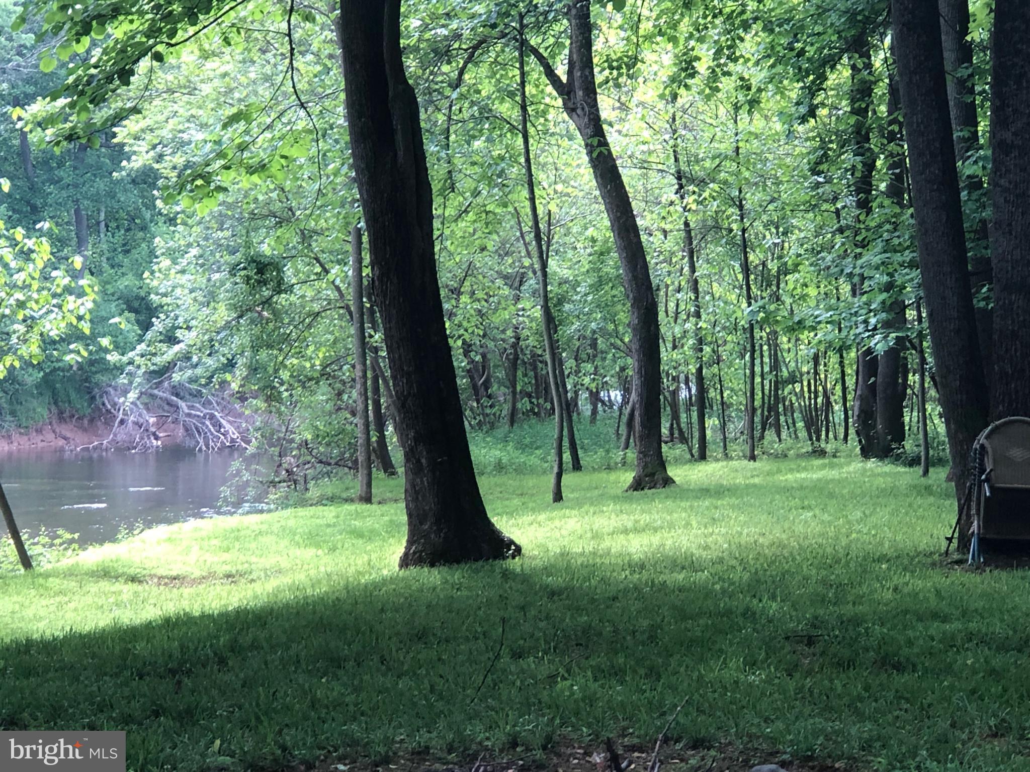 Rare opportunity to own a true piece of paradise.
Gorgeous 5.4 acres in a subdivision with a nature preserve and 250 feet of water frontage on tranquil Back Creek.
The Birch Creek subdivision is located a short 20-minute drive from I-81 and Martinsburg in scenic Back Creek Valley. With large lots and natural beauty, you will feel the tranquility and safety of this unique community. The owner has developed this lot over the past 20 years as a private park for his family and is reluctantly offering it as a perfect place to build your dream home.
Your back yard will include your very own nature preserve on Back Creek. The creek is a 59-mile-long tributary of the Potomac River that flows north from Frederick County, Virginia, to Berkeley County in West Virginia's Eastern Panhandle. Its name reflects its location to the west of North Mountain. The perspective of colonists from the east in the 18th century led them to call it "Back Creek", because it lay to the back of North Mountain. It is fed from numerous natural springs along its course. The nearby Park's Gap Bridge crosses Back Creek at Tomahawk and is listed on the National Register of Historic Places.
Admire the towering trees and walking trails that lead you to the spacious picnic area on Back Creek. You will feel like you are miles away from civilization when you are actually in a subdivision. Walk down to the crystal-clear waters of Back Creek to enjoy the serenity of this amazing property. Pay close attention to the direction of the water as it often appears to be flowing backwards! Property features underground utilities and high speed internet.
Come see and appreciate a wonderous experience!
