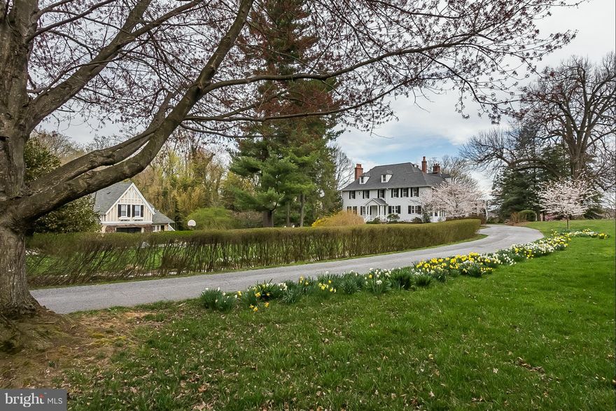 ledger hill cir 1885. meticulously maintained queen anne's style 7.5+acre estate. exquisite ridge top location w/ unparalleled views sweeping gsv. grand living hall flows to expansive wraparound screened porch overlooking stone walled garden. sunroom. original and antique fireplace mantles. mature gardens, fenced pastures. carriage house w/living quarters. supremely convenient.