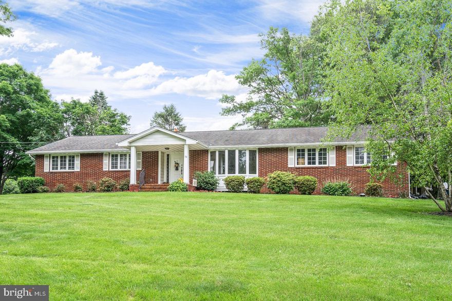 Full brick ranch located in the desirable Hillside neighborhood of Robbinsville.  This house has so much character; wonderful place to rent and call home!  The entry foyer with slate flooring is a great area to meet and greet your guests. Step down to the formal living room with gleaming hardwood floors and freshly painted walls in neutral tones. A large bow window lets in plenty of sunshine and gives you a great view of the front yard. The formal dining room located adjacent to the kitchen also has hardwood flooring.  The eat in kitchen is large enough for any family meal and has plenty of cabinets and counter top space. There is a sizable laundry room as well off the garage as well.  The family room has a full wall upgraded wood burning fireplace.  Main bedroom offers a sizable walk-in closet. The second bedroom includes built in drawers between the closet doors for added storage. Third bedroom is large in size as well; all bedrooms have hardwood flooring.   Main hall bath is renovated.  Large two car side entry garage with access to the basement provides for additional storage. There is a back patio overlooking a private and serene setting.  Robbinsville Schools and excellent location for commuting!
