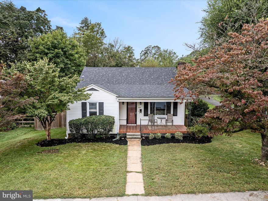 This is your opportunity to own a charming home in the heart of downtown Charles Town, just one block from Jefferson Memorial Park. Featuring 3 bedrooms and 1 bath, this home offers a flexible floor plan and room to grow with a basement rough-in for a full bath and laundry hookups already in place.

The main level welcomes you with hardwood floors, a cozy living room with a wood-burning fireplace, a separate dining room, a functional kitchen (appliances coming), and a bright four-season back porch. Two bedrooms and a full bath complete the main floor.

Upstairs, the third bedroom features a gabled ceiling, generous closet space, and plenty of natural light.

The lower level provides a versatile rec room with a wood stove, walk-out access to the backyard, and excellent potential for future expansion.

Outside, the large 0.24-acre fenced lot is perfect for pets, gardening, or entertaining, and it backs to an alley for added convenience. Relax on the inviting front porch with your morning tea and enjoy the charm of small-town living.

Recent updates include a new roof (2024) and HVAC system (2022), giving peace of mind to the next owner. Street parking and alley parking are both available.

With park amenities like walking trails, tennis and pickleball courts, basketball courts, a pool, and picnic pavilions just steps away, and all of downtown Charles Town within easy reach, this home combines comfort, potential, and location and is ready for your personal touch.