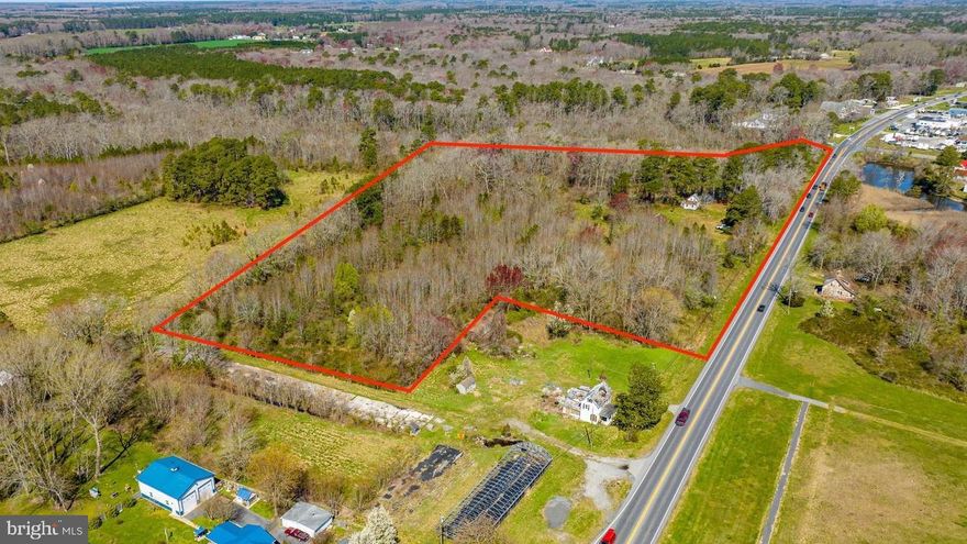 Excellent commercial development opportunity along Racetrack Road situated across from Ocean Downs Casino. Also located just minutes from Ocean Pines, this 9.26+/- -acre parcel includes approximately 7.89 acres of commercially zoned land. Public sewer & water was just made available, while there is still an existing well, septic system, and electric service in place.

Recent improvements include re-zoning to C2 Commercial, an environmental wetland survey with all non-tidal wetlands plated, verified boundary and critical area lines, an approved rezoning removing the Resource Protected line, and a conceptual site plan.  Worcester County’s engineering study has deemed public water and sewer feasible, with approximately 363 EDUs available for a buyer to purchase (buyer to verify on their own with the County), with full availability expected in roughly three years.

With strong visibility across from the Ocean Downs Casino, good traffic counts along this primary growth corridor, and as one of the larger commercially zoned parcels with public sewer available, the property offers exceptional potential for hotel, restaurant, office, or mixed-use development.