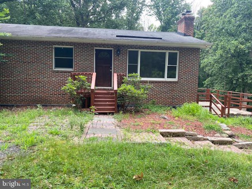 Solid Brick Rambler with 4 bedrooms, 2 full baths located on a private 5+acres lot ,  Wood Floor, A lot of parking spaces .  Lower level with one bedroom and full bath, fireplace and walk-out to backyard. Huge family room
