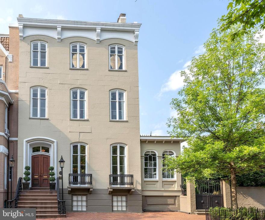 Located in the heart of Old Town Alexandria and offered at a newly improved price. The Bayne-Fowle House is a masterpiece of 19th-century architecture, beautifully restored to blend historic elegance with modern luxury. Set on a double lot with walled gardens, patios, and a two car garage, this 8,600-square-foot mansion offers refined living in a prime location.

A sandstone staircase with wrought iron gas lamps leads to the grand entrance. Inside, the living, dining, and family rooms feature 12’-14' ceilings, intricate plaster cornices, marble fireplaces, and full-length windows with original folding shutters. Pocket doors allow for an open or intimate floor plan, while triple Niermann Weeks chandeliers enhance the space.

The newly renovated kitchen, light-filled breakfast room, and conservatory provide stunning garden views. A charming office, an elegant French-inspired powder room, and a beautifully designed elevator complete this level.

The second floor includes three spacious bedrooms with fireplaces, two full baths, and a large laundry room. The Owner’s Suite offers a luxurious bedroom with garden views, a marble fireplace, an elegant bath with a vessel tub and glass shower, and a breathtaking dressing room with a marble-topped island. An additional laundry room is adjacent.

The upper level features a finished space with exposed brick and historic Civil War-era graffiti. The lower level includes a second family room, a fitness area, a 1,600-bottle wine cellar, and a full bath.

With impeccable gardens, historic charm, and modern amenities, this exceptional residence is just blocks from the Potomac River and top restaurants—ideal for elegant living and entertaining.

Please refer to the virtual tour/property website for additional information and video of this special offering.