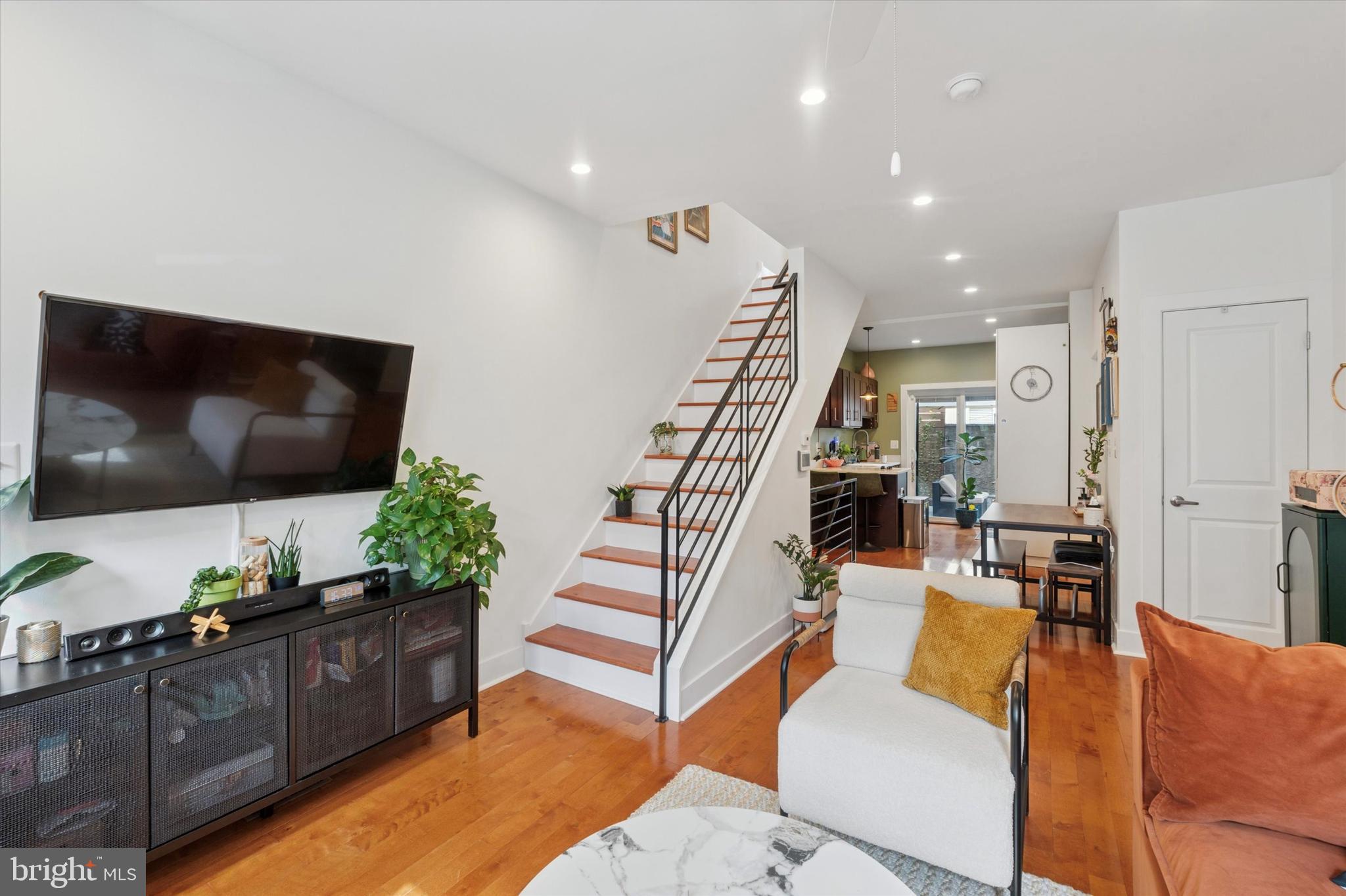 Welcome to this completely renovated brick rowhome in the heart of Point Breeze—combining clean modern design with practical city living, plus the added bonus of a 2-year tax abatement.
Step into a bright, open-concept first floor where hardwood floors and recessed lighting create a warm, inviting feel. The spacious living area flows into a sleek kitchen featuring stainless steel appliances, quartz countertops, a large breakfast bar, and a custom sliding glass door that opens to a private, fenced-in patio—perfect for grilling, outdoor meals, or a quiet cup of coffee.
Upstairs, the primary bedroom offers a peaceful retreat with its own en-suite bathroom and walk-in shower. The second bedroom includes a wall-mounted Murphy bed, offering the flexibility to use the room as a guest space, office, or both—ideal for maximizing space without sacrificing comfort. A second full bathroom is located just off the hallway.
Downstairs, the finished basement adds even more usable space—great for a media room, home gym, or creative studio—with a separate laundry area tucked away for convenience. Central air and heating ensure year-round comfort.
This home was completely gut renovated in 2018 and is located on a quiet block, yet just steps from Point Breeze’s popular restaurants, cafés, and shops, and only a short walk to the Broad Street Line for an easy commute.
Schedule your showing today and see all the smart features and flexible living this home has to offer.