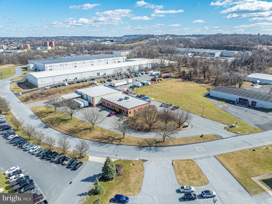 13,000 square foot office and warehouse space. This highly versatile property is zoned general commercial and conveniently situated near I-83 and I-283, offering seamless access and endless possibilities. 6 loading dock bays (3 for 18-wheelers, 3 for box/smaller trucks)
3 12-ft bay doors; 2 are drive-in to warehouse, 1 is accessible from the loading docks. Reception area, private offices and larger training rooms. Parking area for 35 staff/visitor parking. Fenced-in area has room for parking 20+ trucks. 5 acres provides privacy and room for growth. ADA accessible.