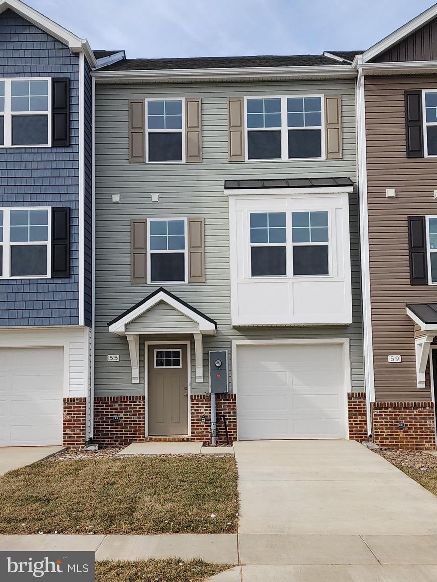 This interior-unit 4 bedroom, 3.5 bath garage townhome has an open concept design on the main floor w/ a kitchen island with granite top, 42" Painted Boulder colored cabinets, a high low peninsula with granite top for entertaining, stainless-steel appliances, a large living room w/ a bump out and a half bath. The upper level features a large primary bedroom w/ cathedral ceiling, walk-in closet, double vanity and a walk-in tile shower; two guest bedrooms, full guest bathroom, linen closet and laundry. The lower levels feature a coat closet, foyer, single car garage w/ automatic garage door opener (app enabled also) and fourth bedroom with a full bath & linen closet and a door to access to your large backyard, this room makes a great recreation room as well. There are NO homes built behind you here, pasture view!!! Throughout the home you will find recessed LED's, ceiling fans in the Primary bedroom & living room w/ each additional bedroom pre-wired for ceiling fans. High/Low outlets w/ pass through plates w/ CAT5/COAX/HDMI in Owner's bedroom & living room to make mounting your TV a breeze.