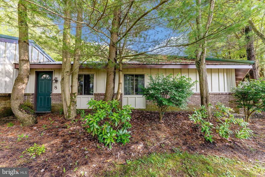 Experience year-round adventure in this cozy 1-bedroom condo located in the heart of Deep Creek Lake. Perfect as a weekend retreat or investment property, this low-maintenance unit features recently updated metal siding and offers a quiet location with a private setting—just minutes from the slopes of Wisp Resort and everything Deep Creek Lake has to offer. Enjoy summer days on the water and winter fun on the mountain, all from the comfort of your own getaway. Whether you're seeking a seasonal escape or a smart rental opportunity, this condo is your base for all-season enjoyment.