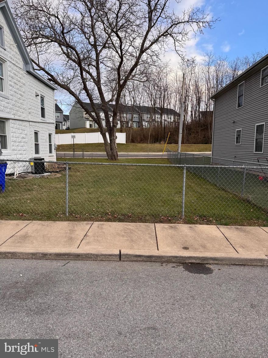 .04 city lot for sale. Public water and sewer hookup. 474 Mitchell Ave also for sale next door for $185,000.  But both and have a nice fenced in yard for single family home.