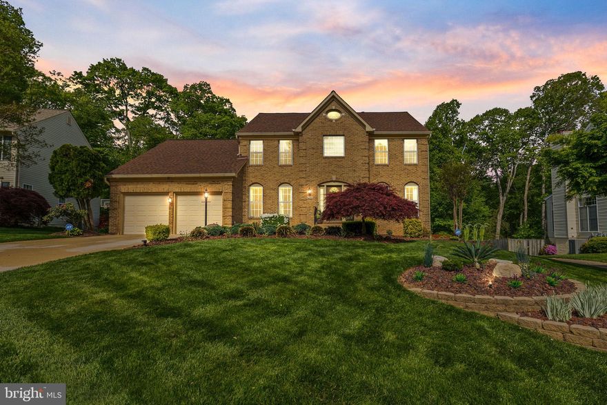 Welcome to this stunning brick-front home featuring 5 bedrooms, 3.5 bathrooms, and a spacious 2-car garage! The upper level boasts a luxurious primary suite with two walk-in closets and a fully remodeled (2025) en suite bath complete with a granite double vanity, soaking tub, and a beautifully tiled shower. Three additional bedrooms share a well-appointed hall bathroom.
The main level offers a formal living room, office/den area, formal dining room, and a cozy family room with a wood-burning fireplace. The eat-in kitchen, completely remodeled in 2017, is a chef’s dream with heated floors, soft-close cabinets with pull-out shelving, granite countertops, stainless steel appliances, double wall ovens, built-ins, and a wine refrigerator. Hardwood floors run throughout the formal living and dining rooms. A convenient main-level laundry room adds practicality, and you’ll love stepping out to the deck and screened-in porch—complete with lighting, ceiling fan, television, and outdoor stereo system (all conveying with the home).
The lower level offers an abundance of space designed for both comfort and versatility. A spacious recreation room, complete with built-in shelving, provides the perfect setting for movie nights, game days, or casual gatherings. The bonus room makes an excellent home gym or playroom. There’s also a dedicated office or den space, ideal for working from home or quiet study. The fifth bedroom and a full bathroom on this level offer a private retreat for guests or extended family. Additionally, a large cedar closet adds abundant storage space. With walk-out access to the backyard, this level seamlessly extends your living and entertaining areas outdoors.
Step into your own backyard paradise—an impeccably landscaped, fully fenced sanctuary enhanced with lighting and a cascading waterfall. Enjoy the recently remodeled 28,000-gallon gunite pool and hot tub combo (2021), featuring new plaster, coping, tile work, vibrant LED lighting, a Polaris pool cleaner, and a spring-loaded winter cover. This exceptional outdoor space backs to a peaceful common area with mature trees, a pond,  and a seating area.
Additional upgrades include a new roof with lifetime guaranteed shingles (2018), a new Carrier Infinity HVAC system (2023), a new hot water heater (2024), and a monitored ADT 360-degree camera system for peace of mind.
Located in the sought-after Highbridge community, just off Cardinal Drive, this home offers easy access to Route 1 and I-95—perfect for commuters. Enjoy the convenience of nearby shopping and dining, with Stone Bridge and Potomac Mills Mall just minutes away. Close to Prince William Forest Park, which offers miles of scenic trails and natural beauty. Do not miss this opportunity to call this home yours!