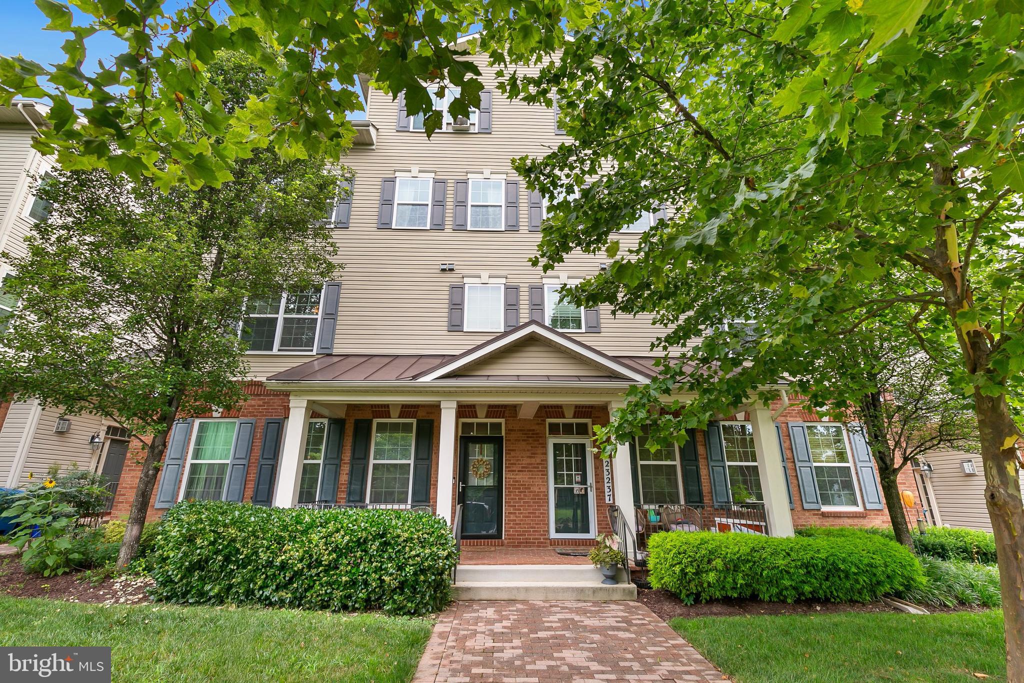 This remarkable three-level, end-unit townhome boasts an inviting open floor plan and lots of natural light. Located in the highly desirable Gateway Commons neighborhood, this residence comprises three bedrooms and three bathrooms. Just moments away from the renowned Clarksburg Outlets, as well as the convenient I-270 and Rt 355 routes, 2.5 miles to Harris Teeter in Clarksburg and 4 miles to Wegmans in Germantown. A charming covered front porch looks out to an expansive open, green space, creating a relaxing and peaceful view. The modern main level features new luxury vinyl plank flooring, a gas fireplace with marble surround and mantel, a new powder room, and a renovated kitchen. The stunningly updated kitchen boasts 42-inch white cabinets, granite countertops with a breakfast bar, recessed lighting, stainless steel appliances, a custom backsplash, and a spacious pantry. The second level unveils a secluded owner's suite with a spa-like bathroom; complete with a shower stall, a generously sized corner soaking tub, and a double vanity. Additionally, the second level houses a conveniently located laundry room, complete with new washer and dryer that will be included with the home. The third level reveals two sizable bedrooms, a full bathroom with a tub and shower combination, and an elegant, versatile loft area ideal for a home office, a cozy spot to watch television, playroom, etc. This amazing property also features an attached garage accompanied by a driveway, while visitor parking is readily available at the rear of the home. The owner is relocating for work, so this wonderful home needs new owners; come make it yours. ***Bundled service pricing available for buyers. Connect with the listing agent for details; text is best way to connect***